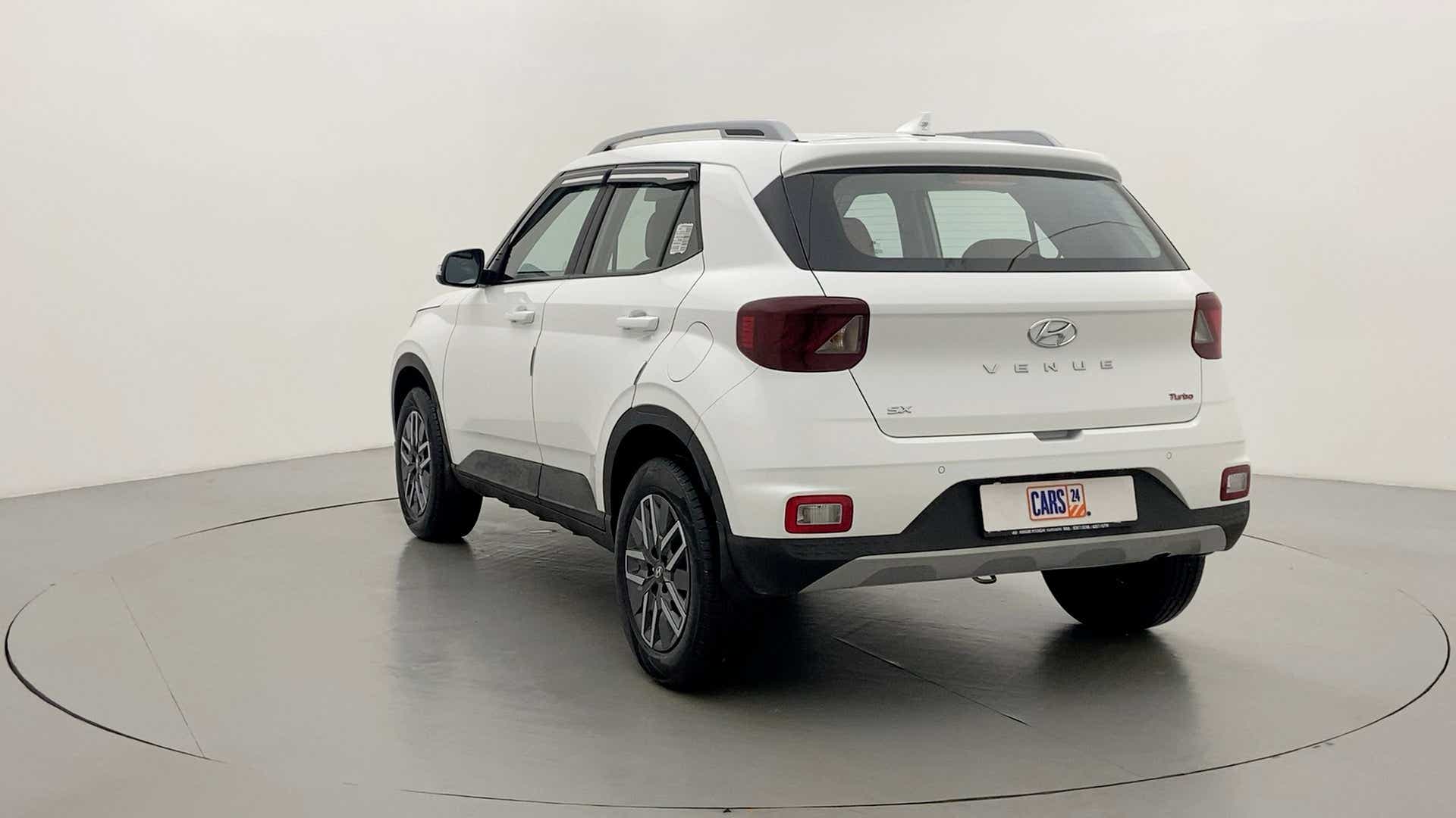 Rear three-quarter of a Atlas White Hyundai Venue SX Turbo