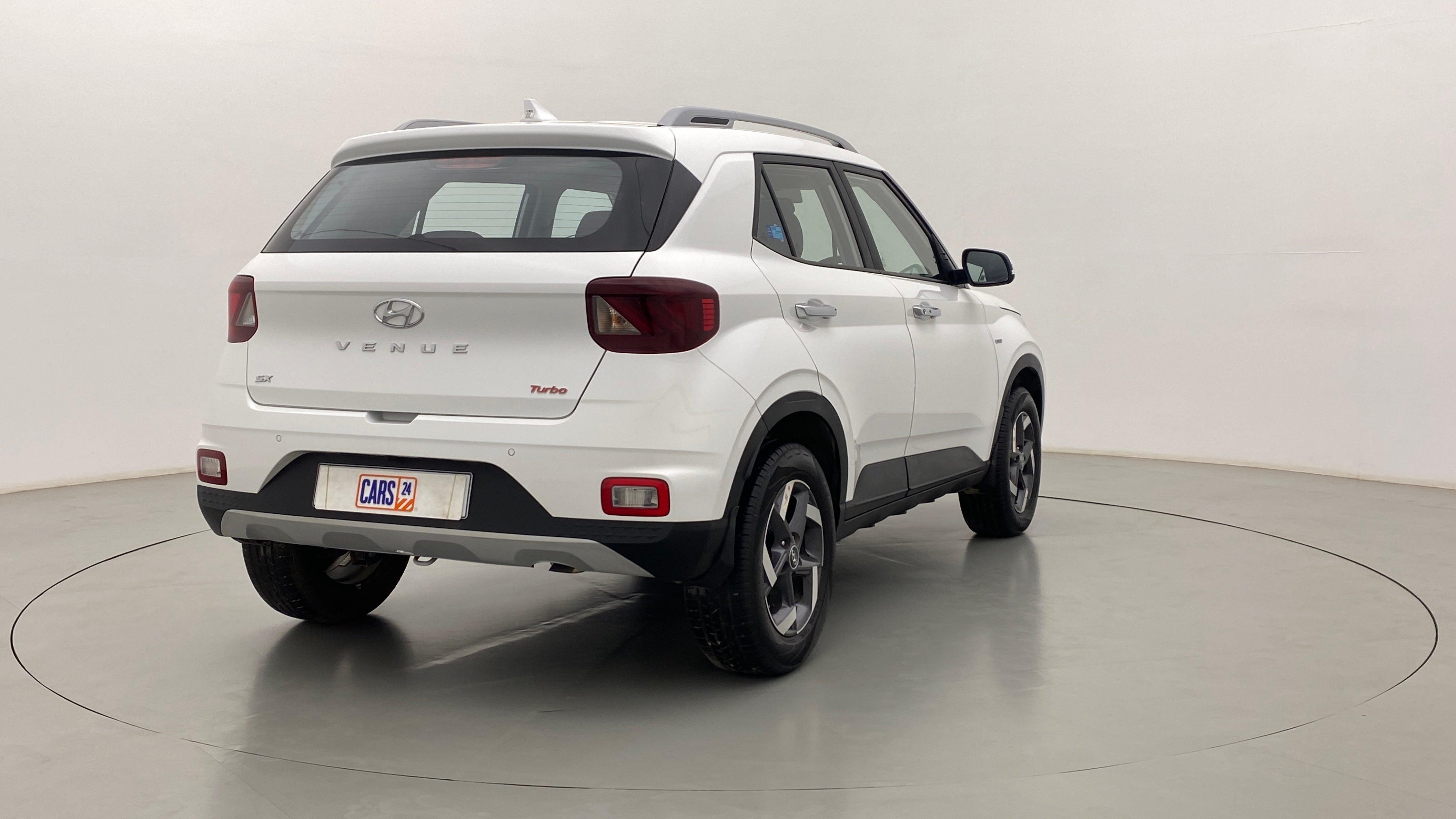 Rear three-quarter of a Hyundai Venue in a studio setting