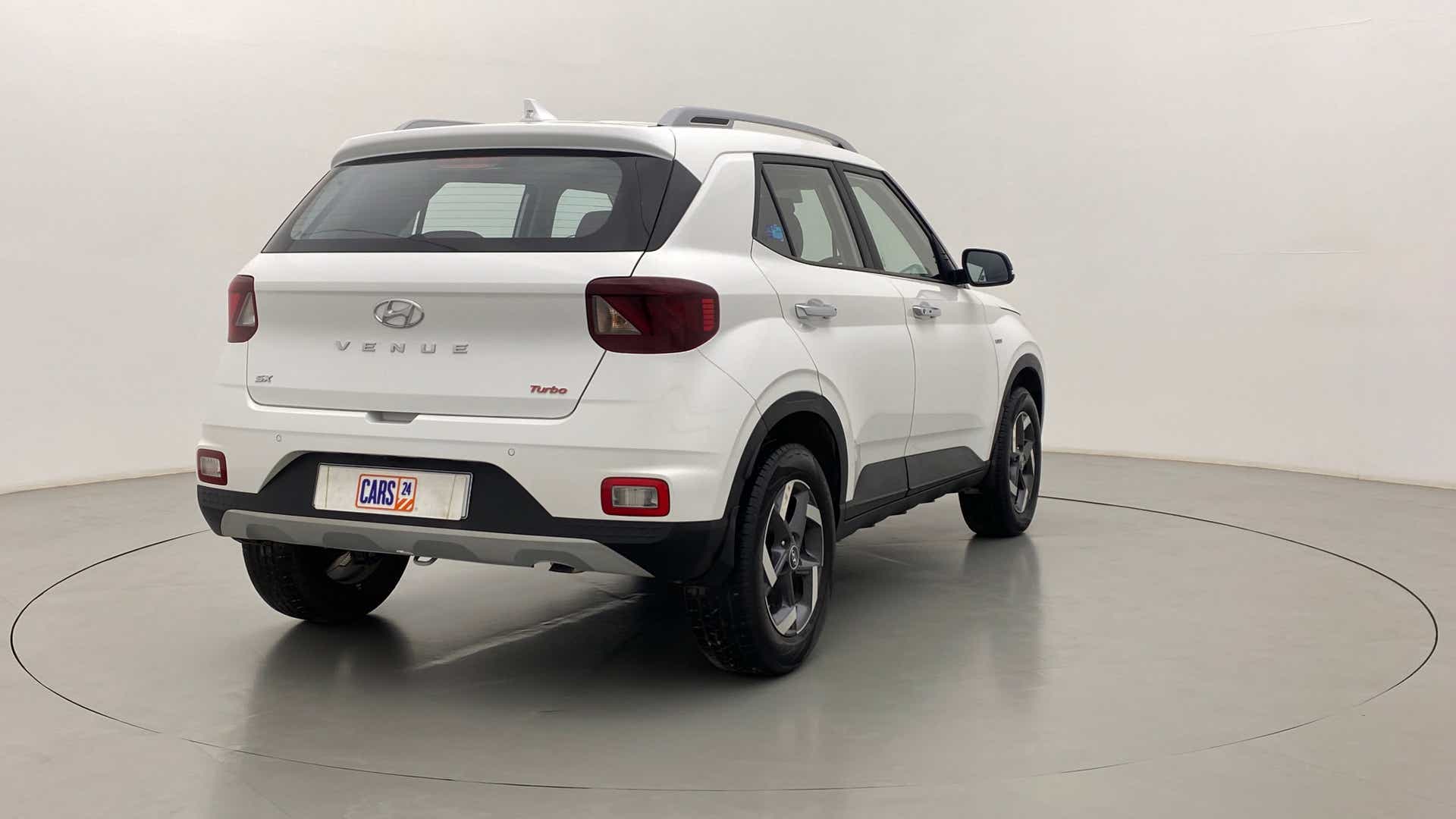 Rear three-quarter of a Hyundai Venue in a studio setting