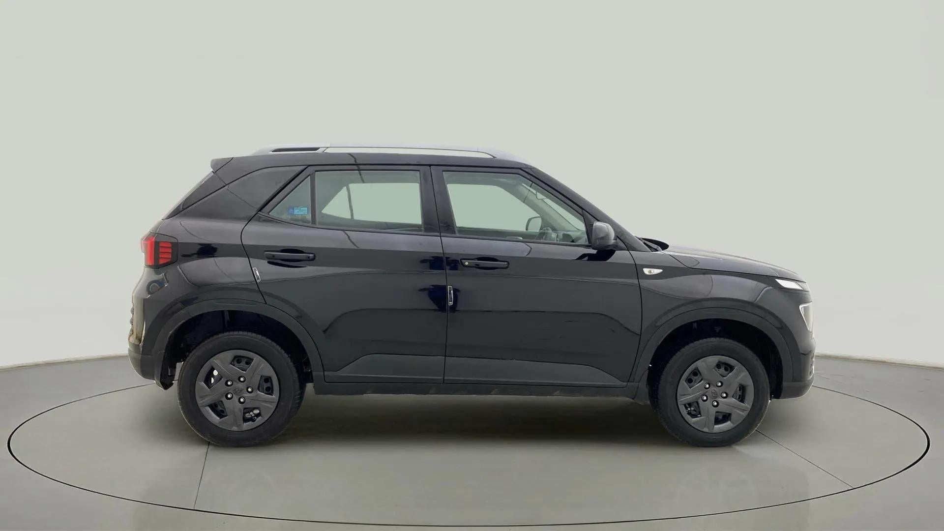 Side view of a Abyss Black Hyundai Venue