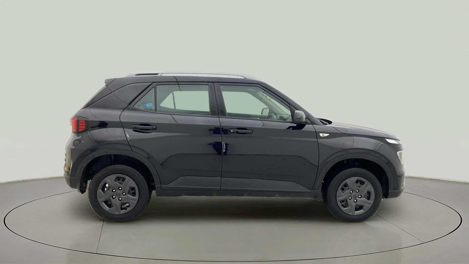 Side view of a Abyss Black Hyundai Venue