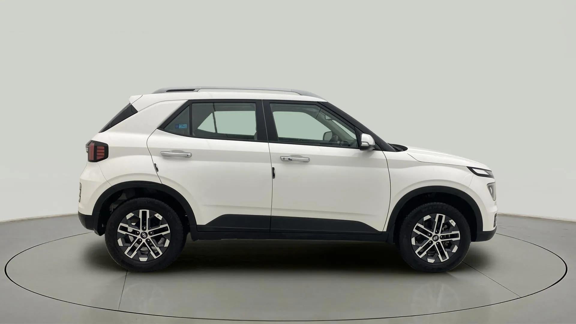 Side view of a Atlas White Hyundai Venue