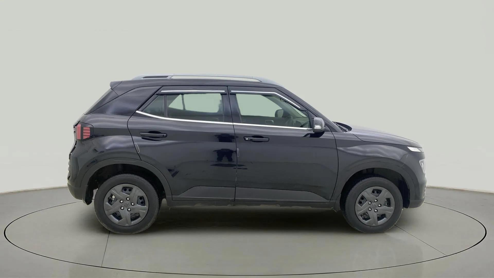 Side view of a Abyss Black Hyundai Venue