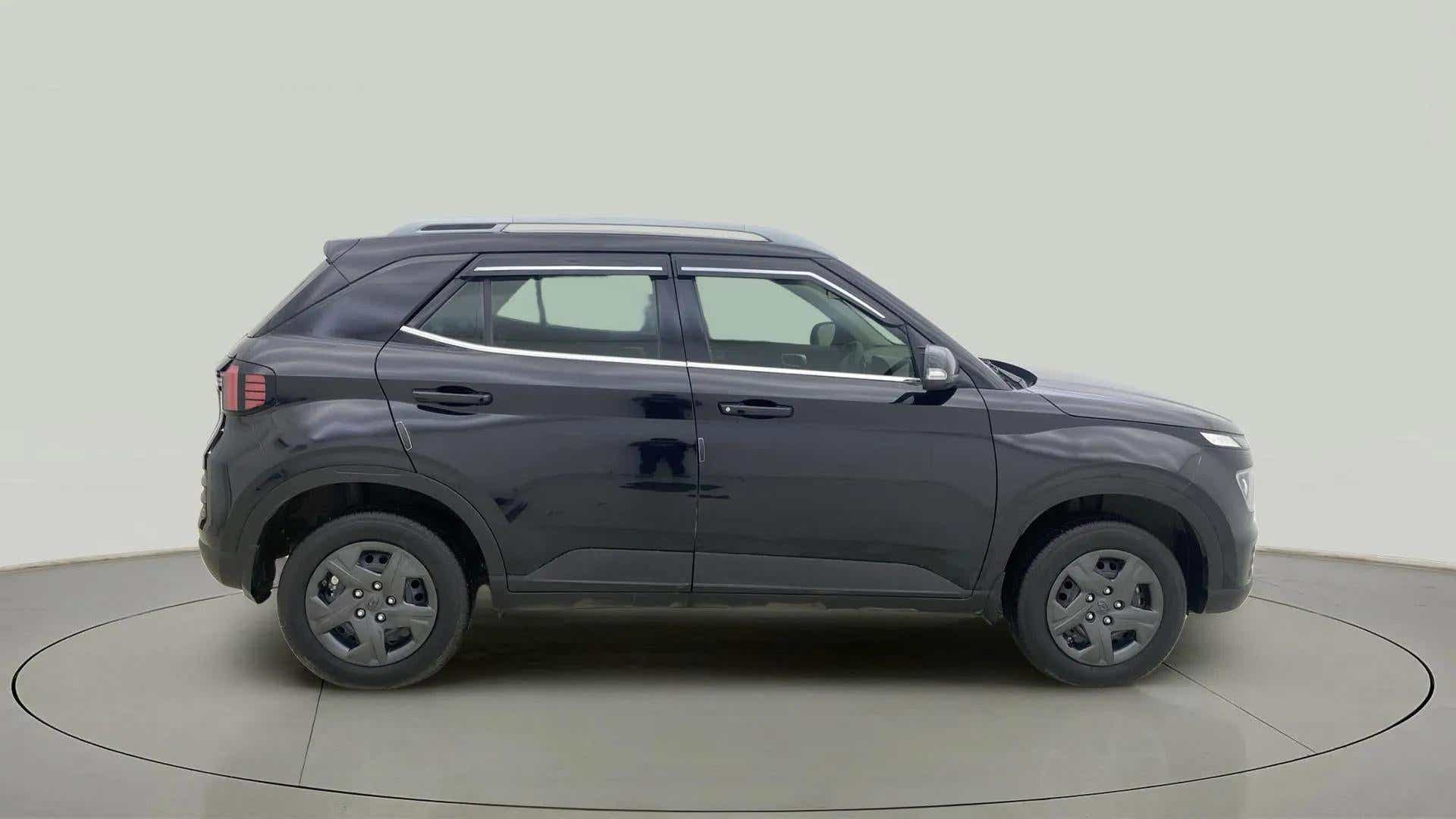 Side view of a Abyss Black Hyundai Venue