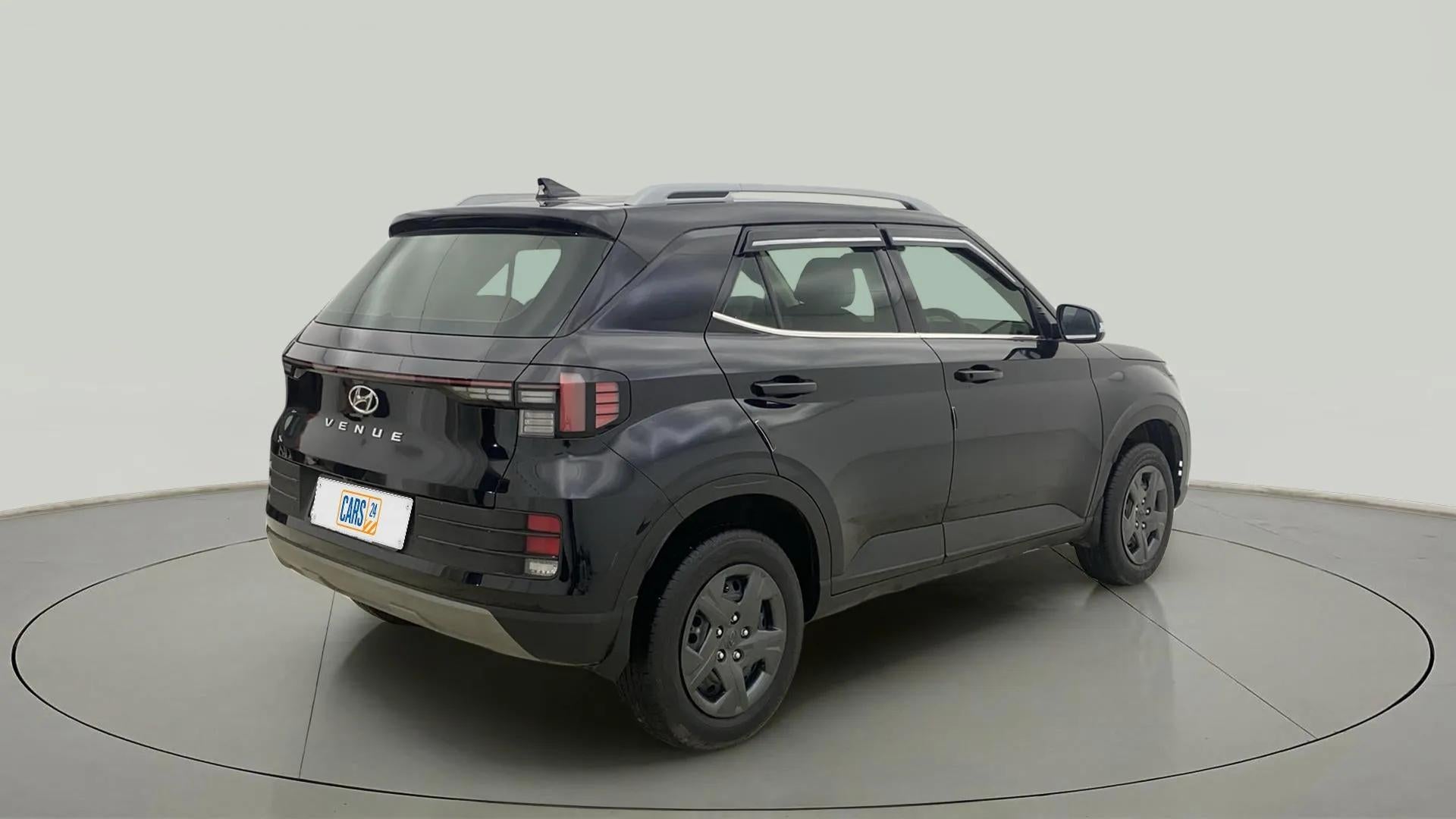 Rear three-quarter view of a Abyss Black Hyundai Venue