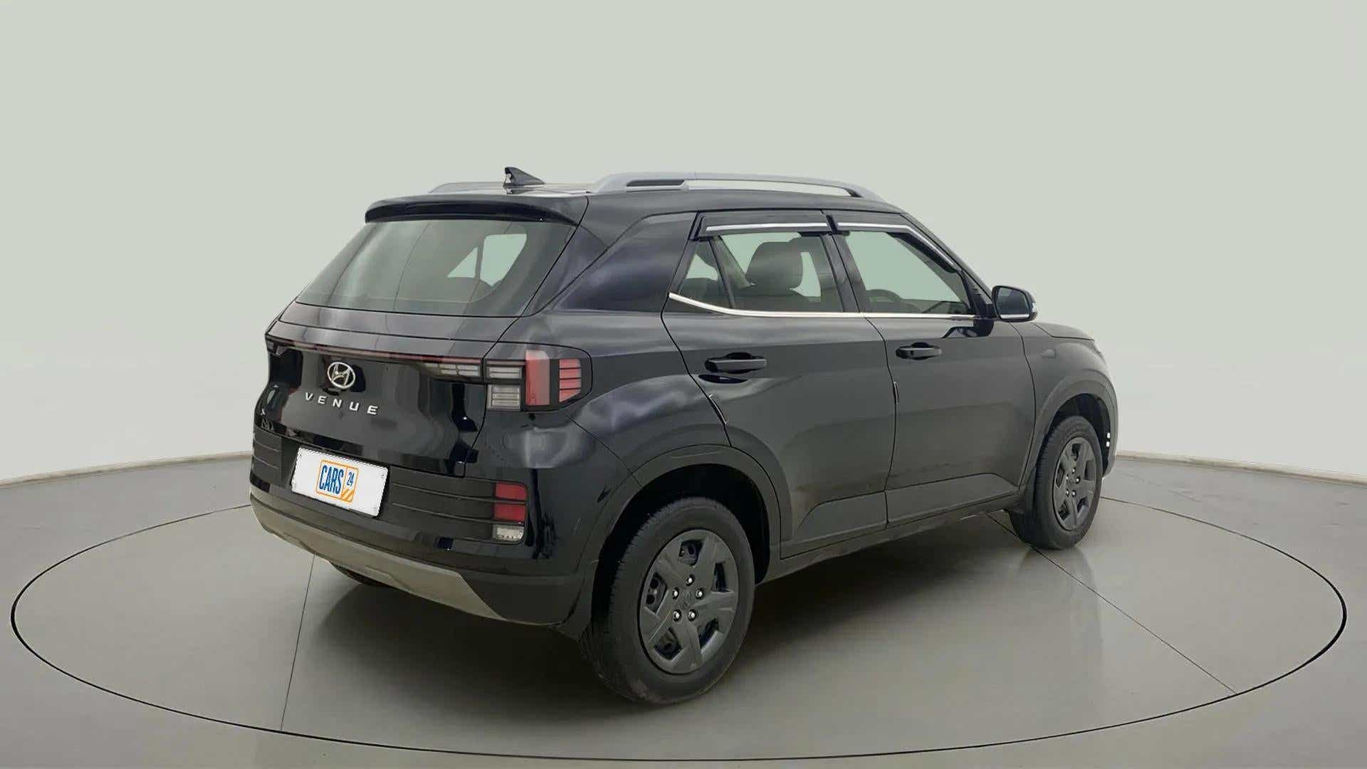 Rear three-quarter view of a Abyss Black Hyundai Venue