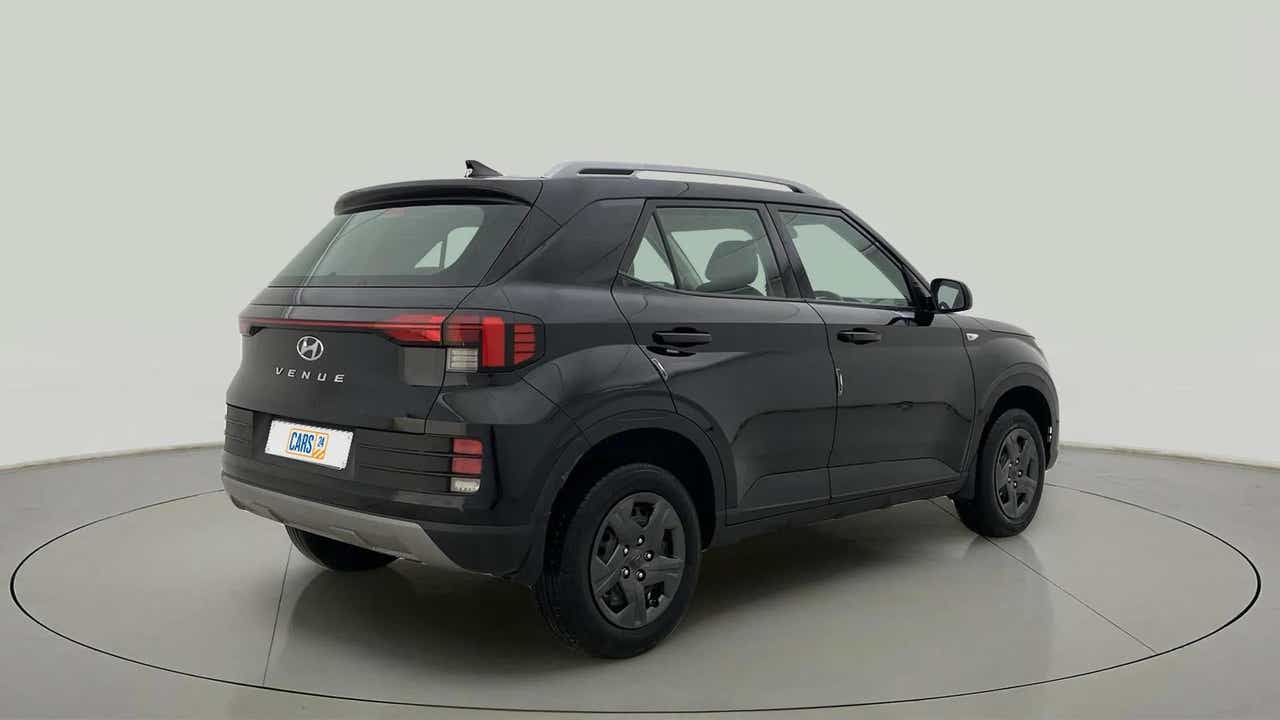 Rear three-quarter of a Abyss Black Hyundai Venue