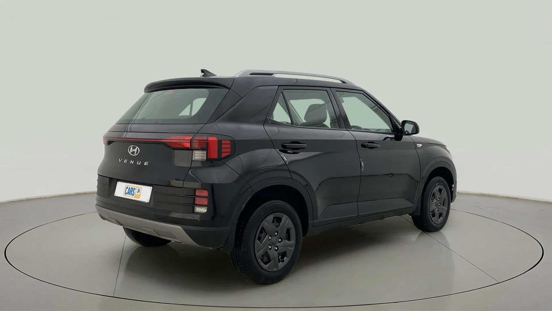 Rear three-quarter of a Abyss Black Hyundai Venue