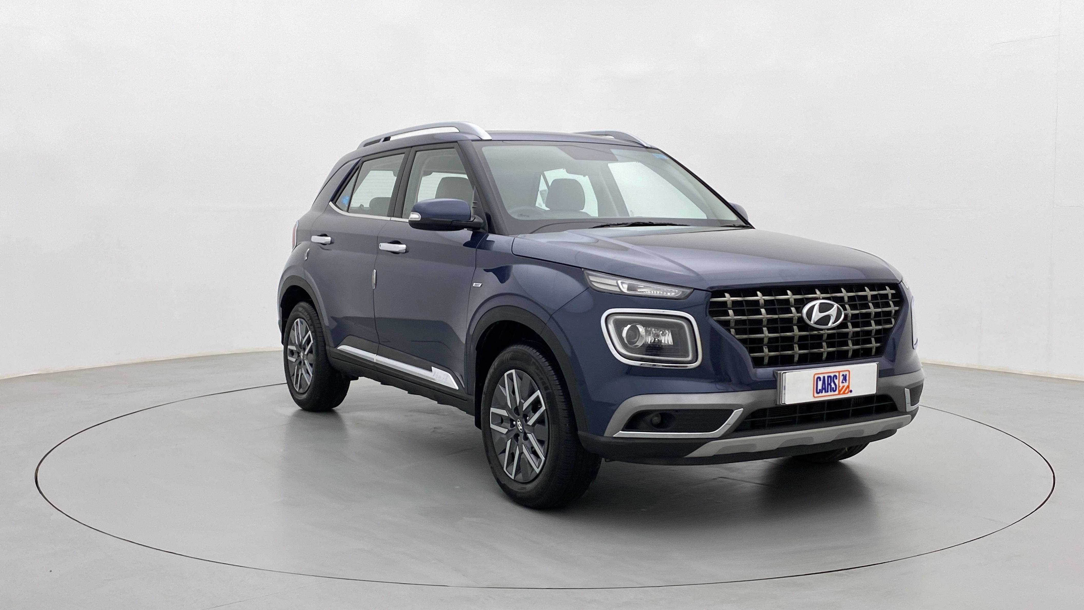 Front three-quarter view of a Denim Blue Hyundai Venue