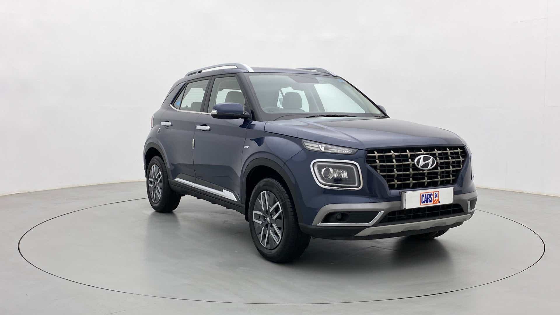 Front three-quarter view of a Denim Blue Hyundai Venue