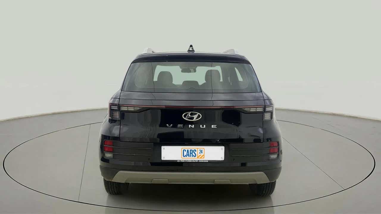 Rear view of a abyss black Hyundai Venue
