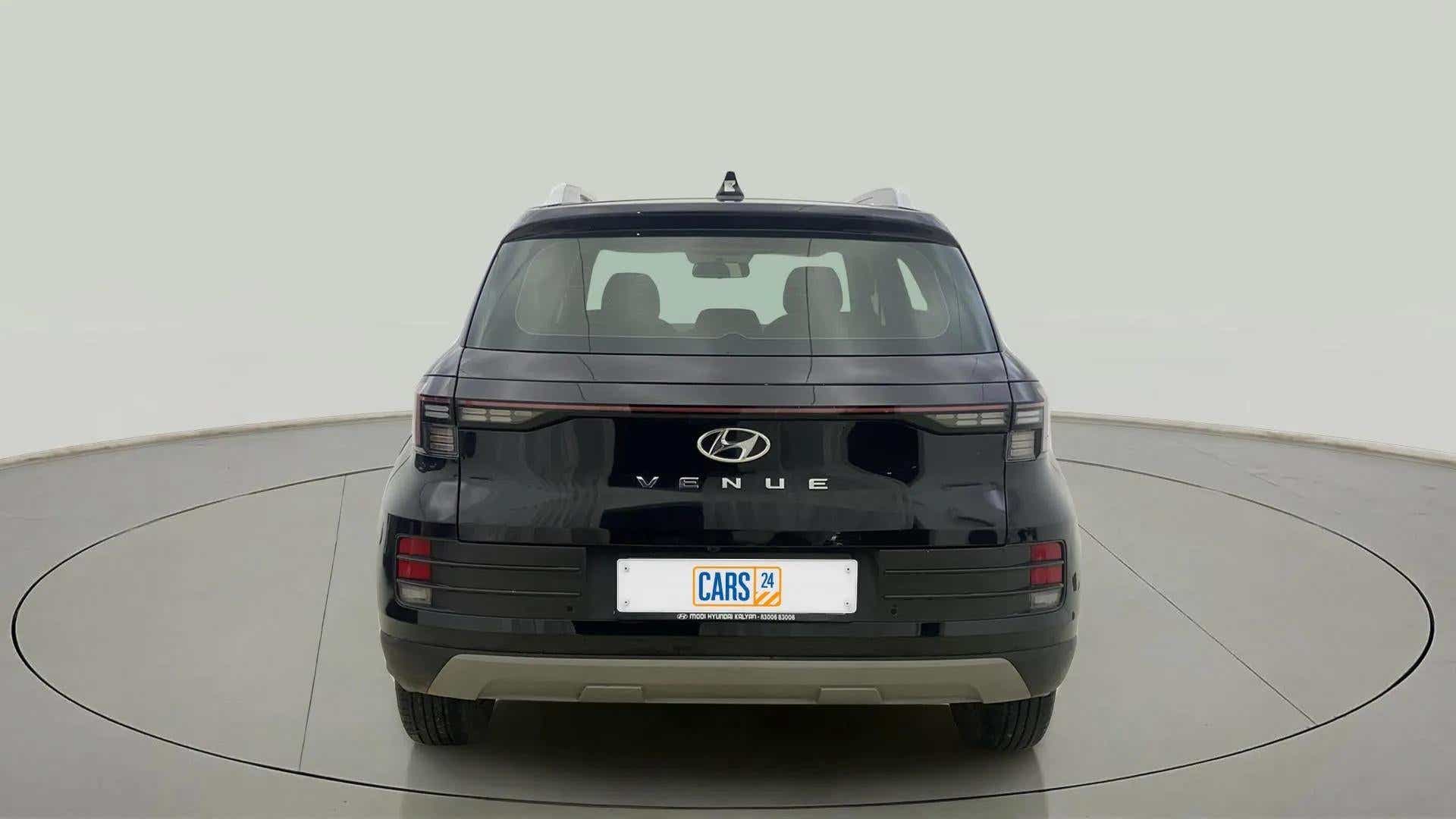 Rear view of a abyss black Hyundai Venue