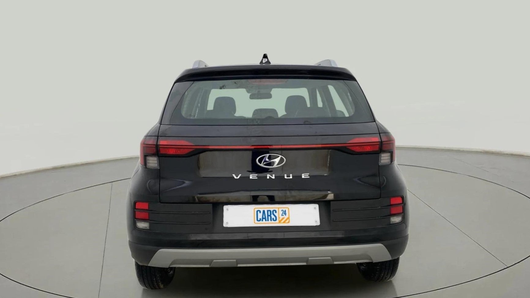 Rear view of a abyss black Hyundai Venue