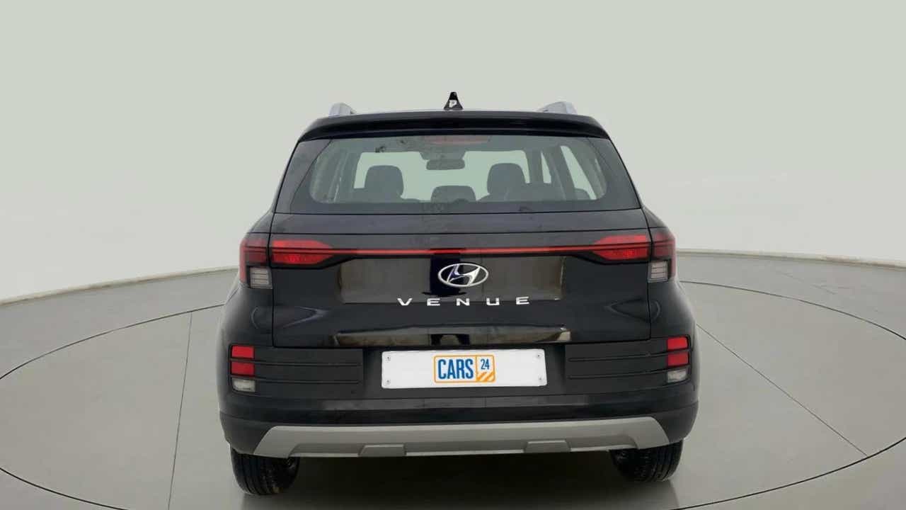Rear view of a abyss black Hyundai Venue