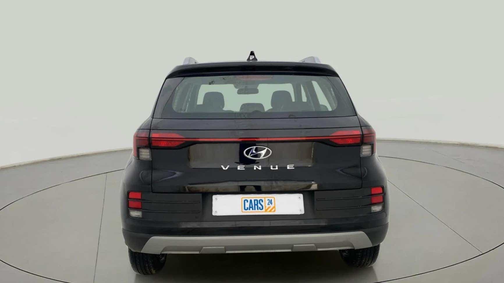 Rear view of a abyss black Hyundai Venue