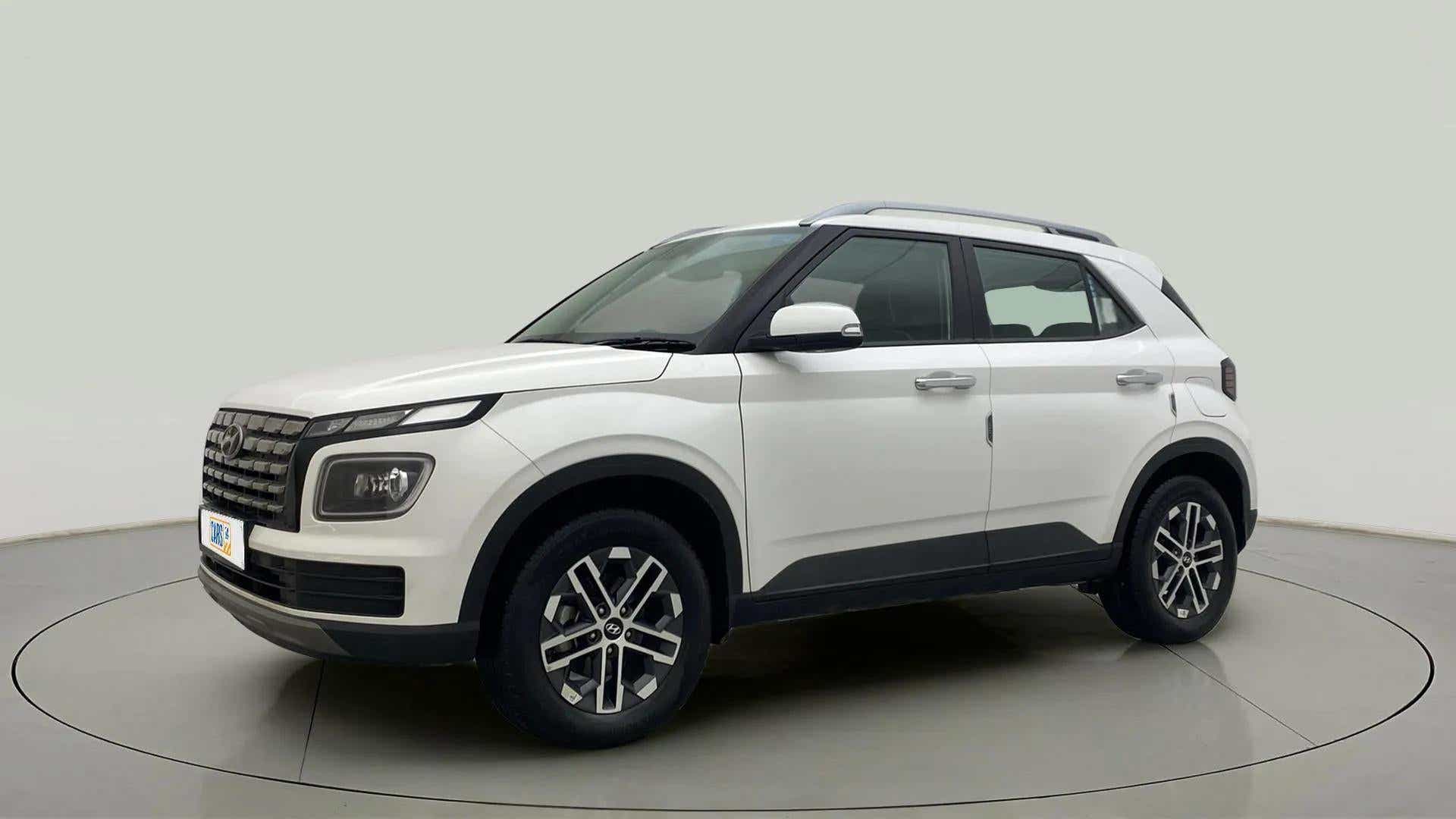 Front three-quarter view of a atlas white Hyundai Venue