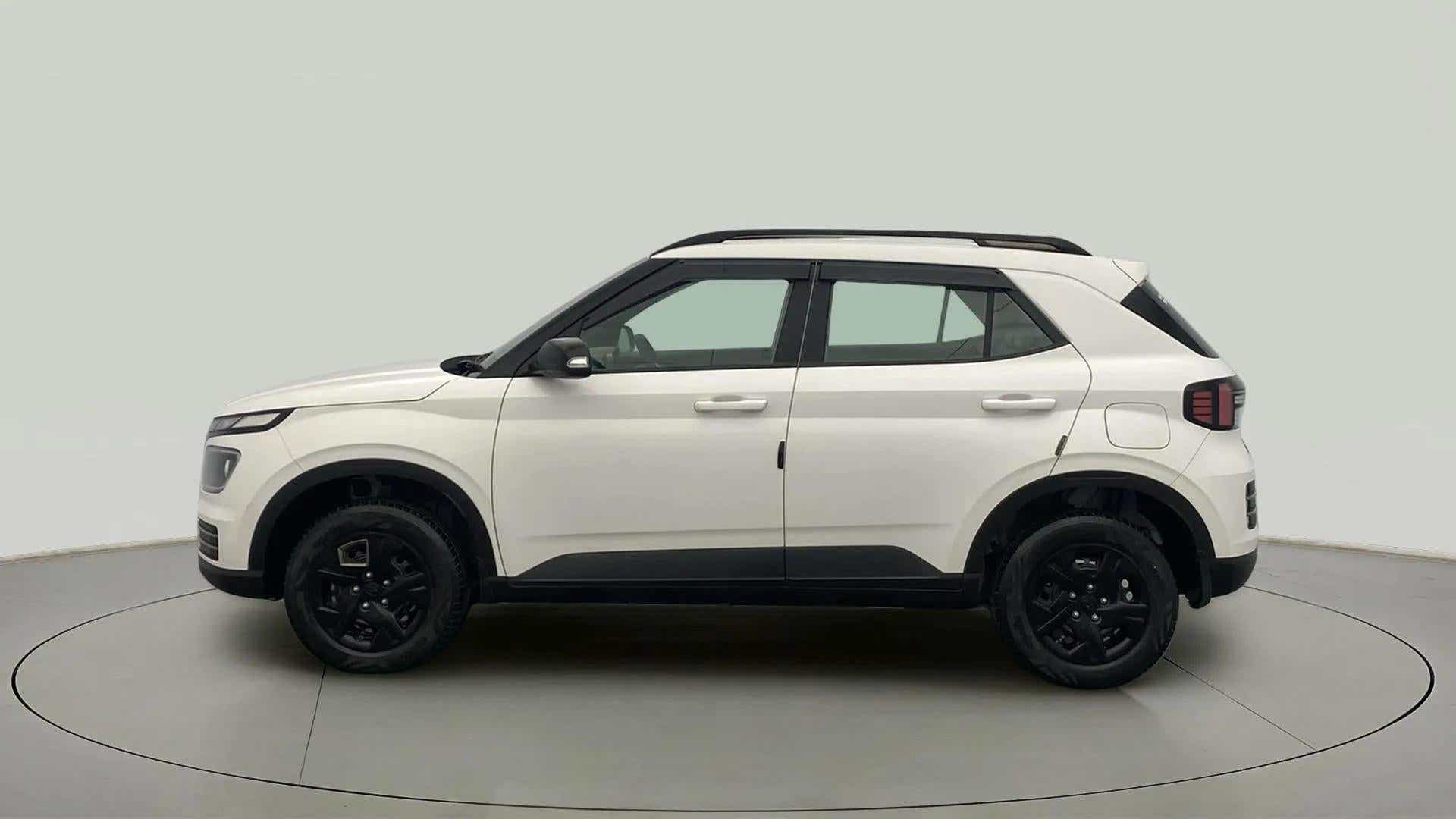 Side view of a Atlas White Hyundai Venue