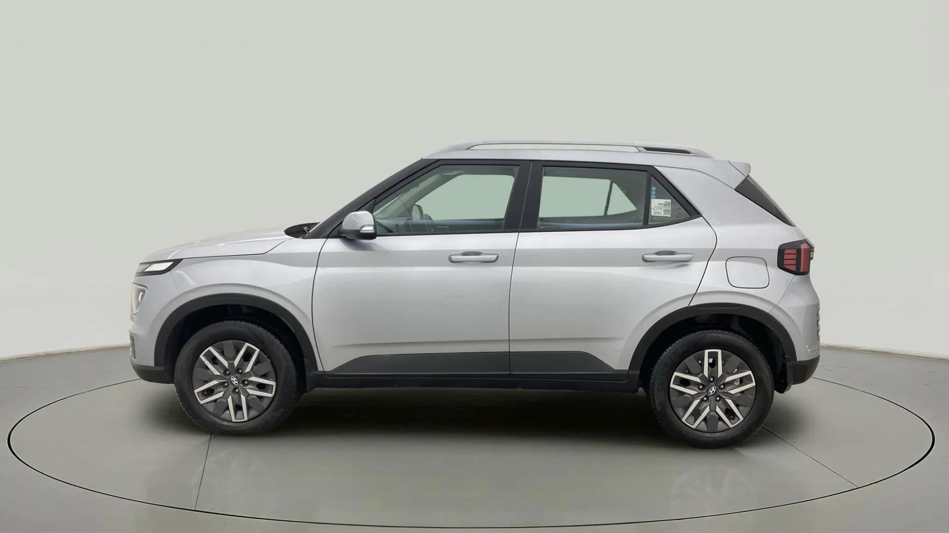 Side view of a Typhoon Silver Hyundai Venue