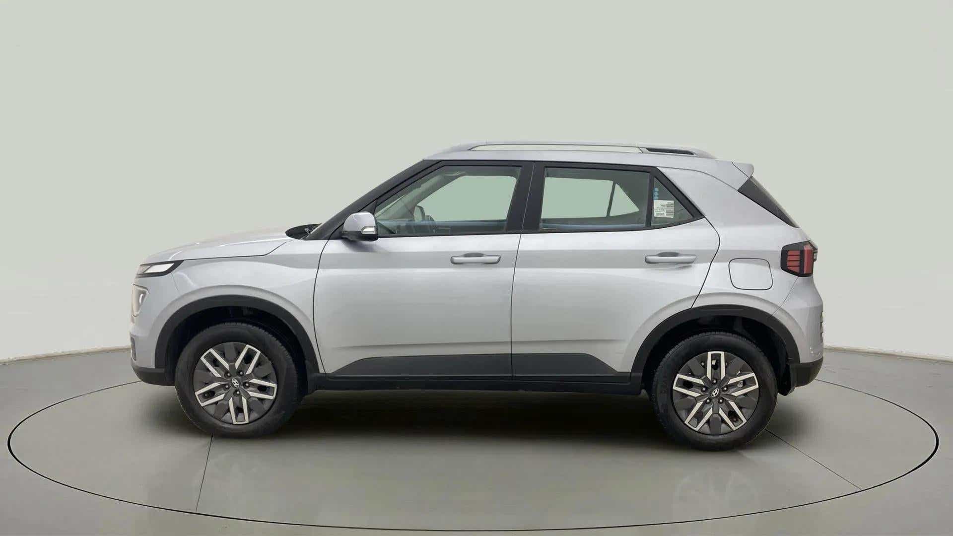 Side view of a Typhoon Silver Hyundai Venue