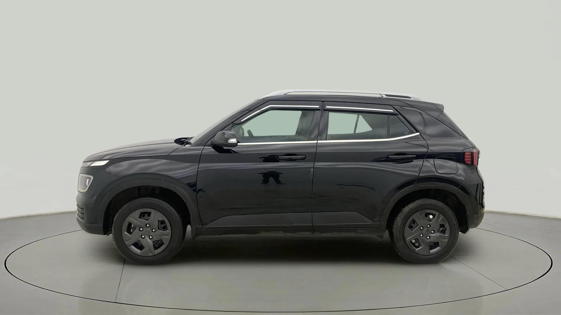 Side view of a abyss black Hyundai Venue