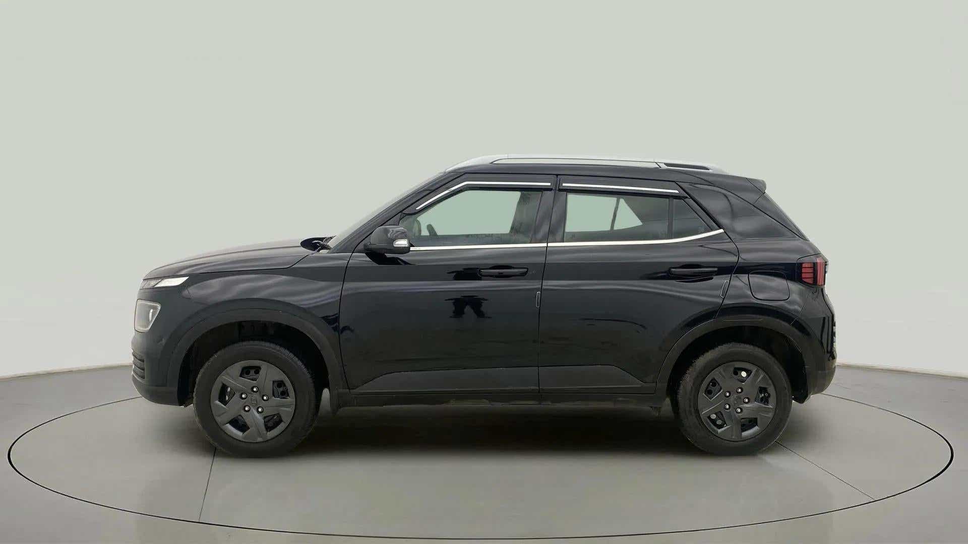 Side view of a abyss black Hyundai Venue