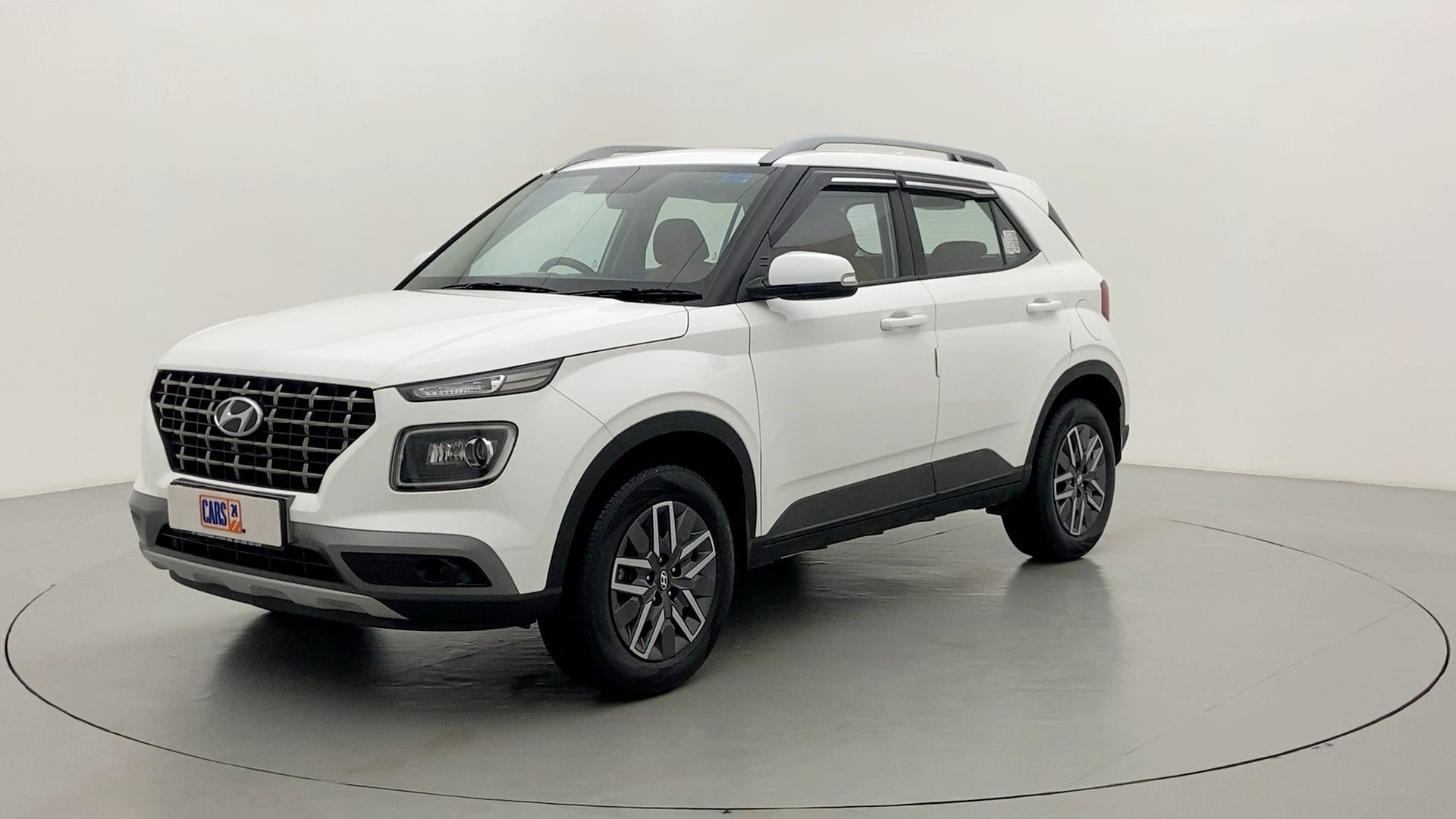 Front three-quarter of a Atlas White Hyundai Venue