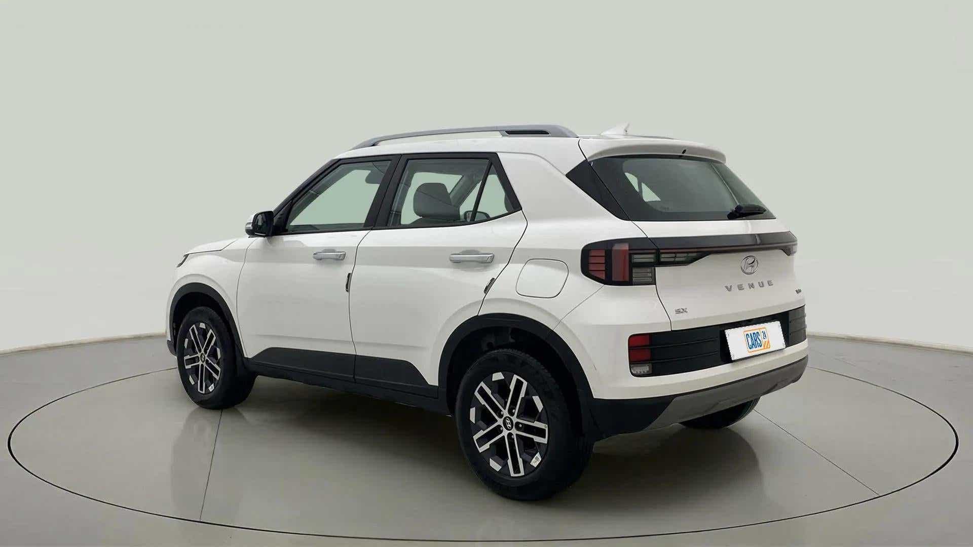 Rear three-quarter view of a Atlas White Hyundai Venue SX