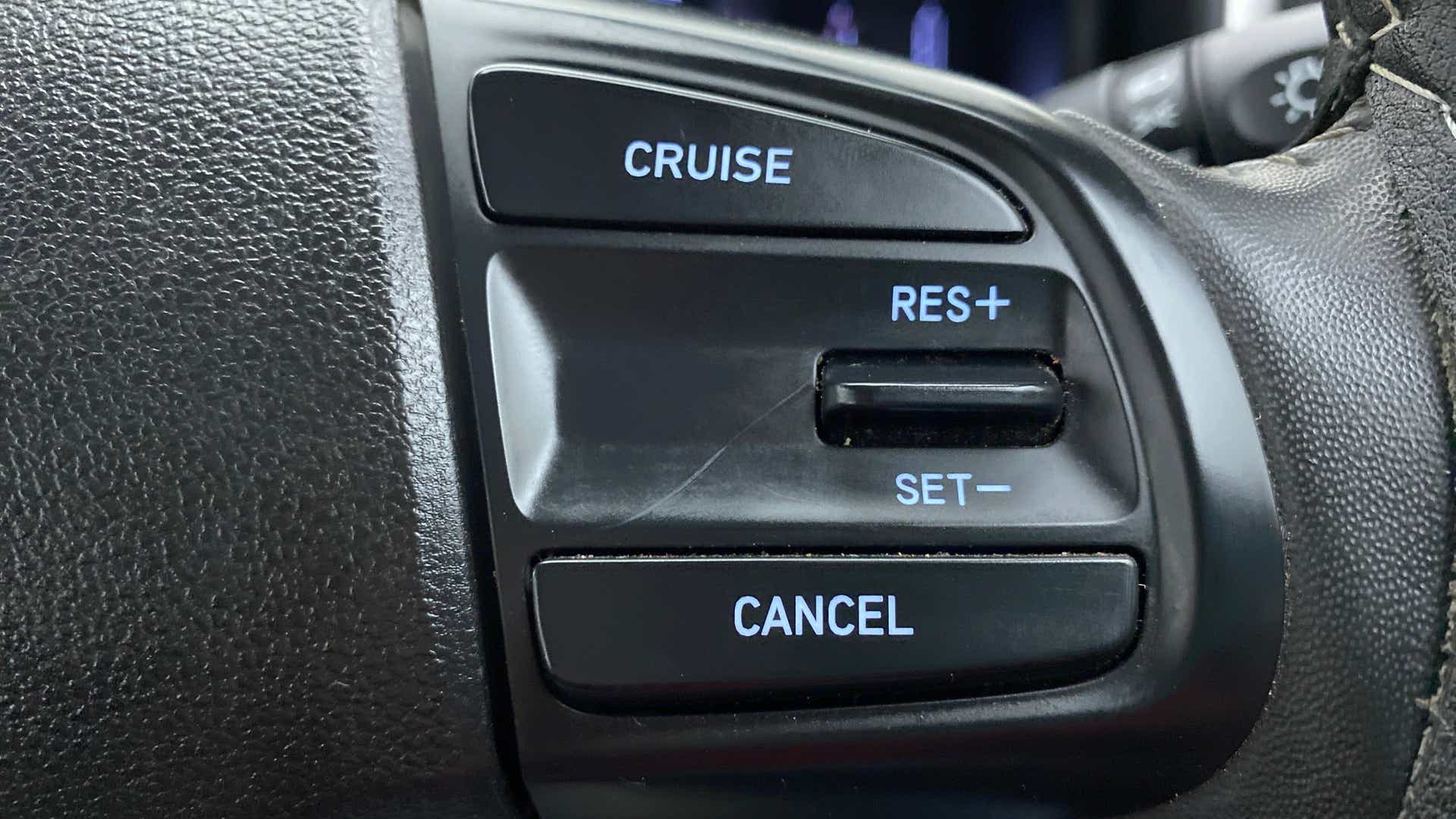 Cruise control buttons on a Hyundai Venue steering wheel