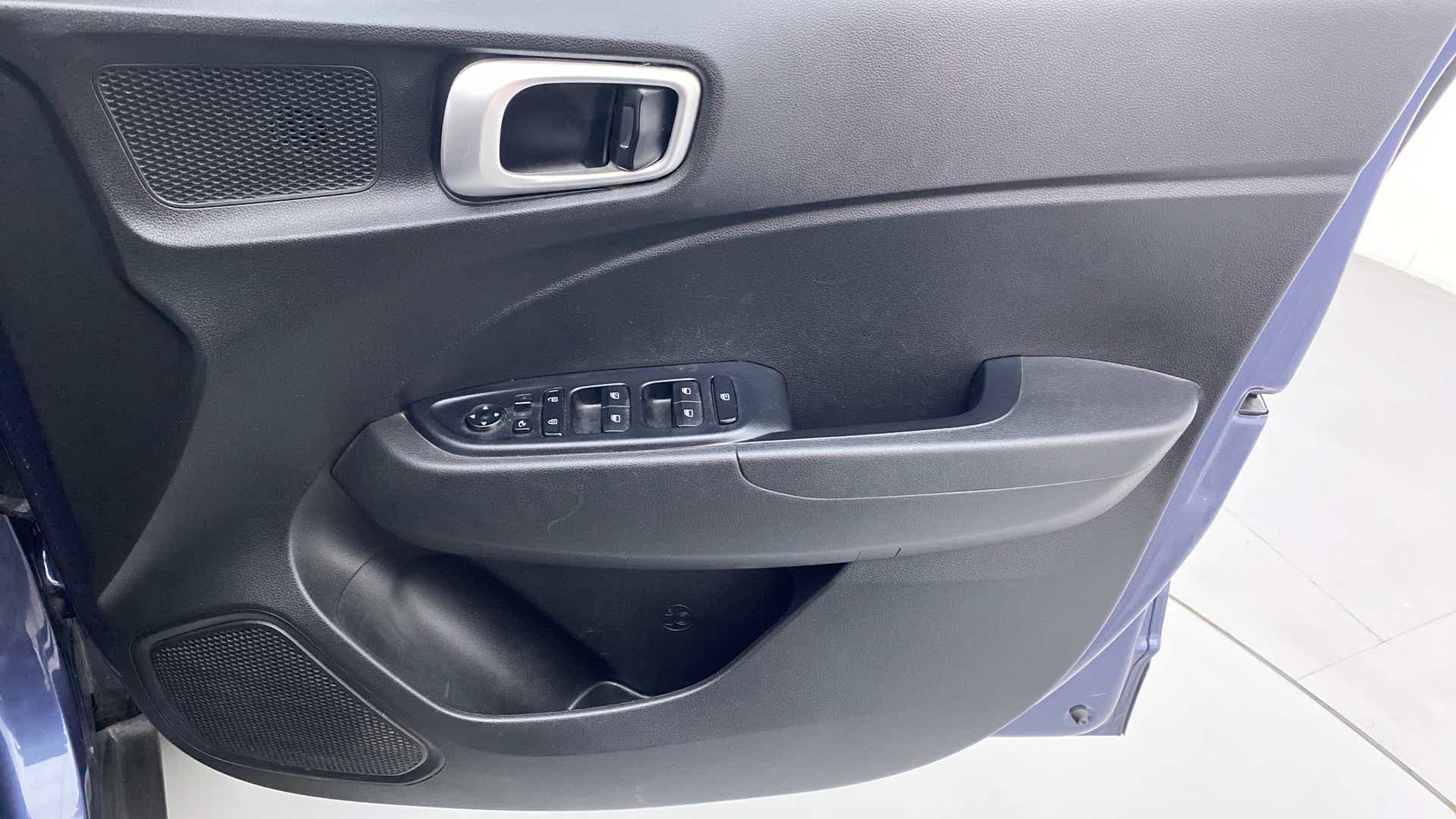 Close-up of the driver side door panel of a Hyundai Venue