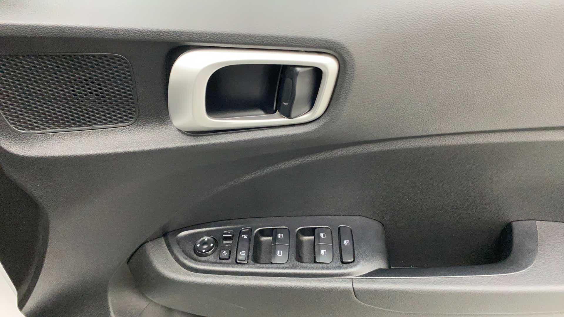 Interior front door controls and handle of a Hyundai Venue
