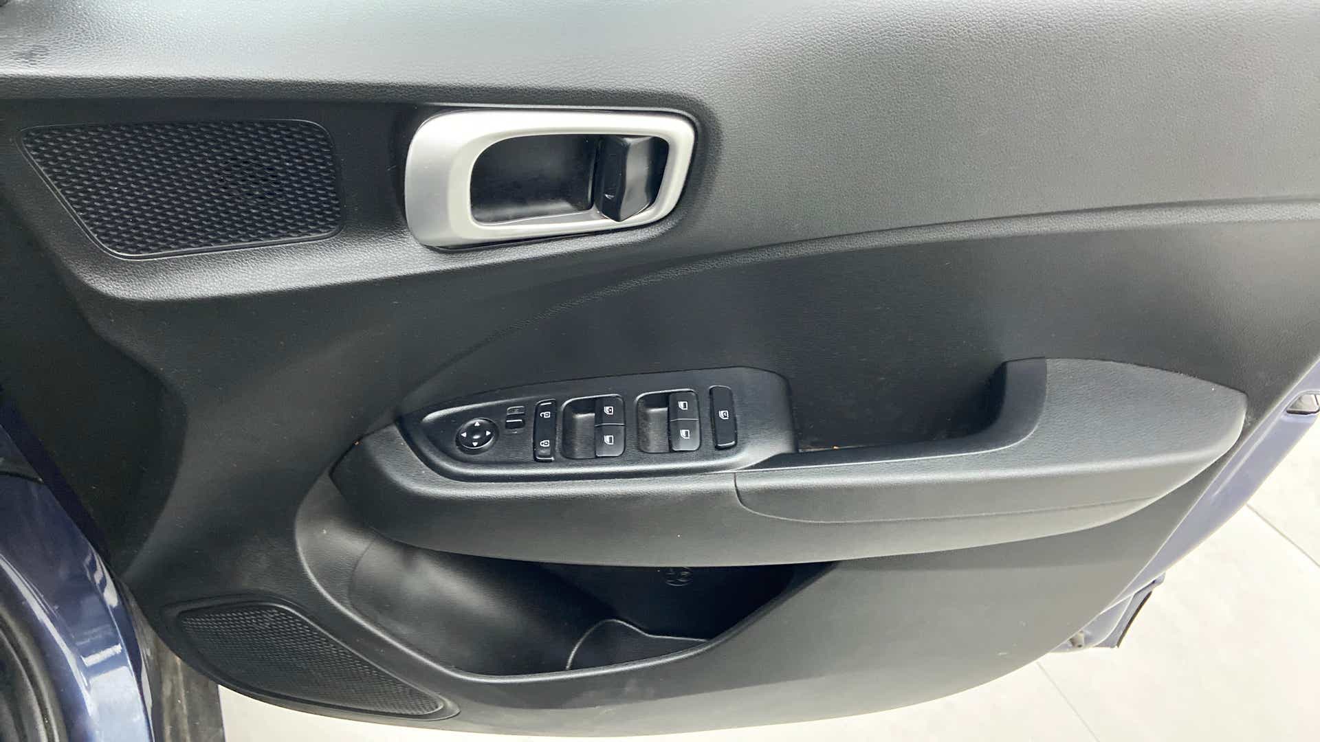 Interior driver side door panel of a Hyundai Venue