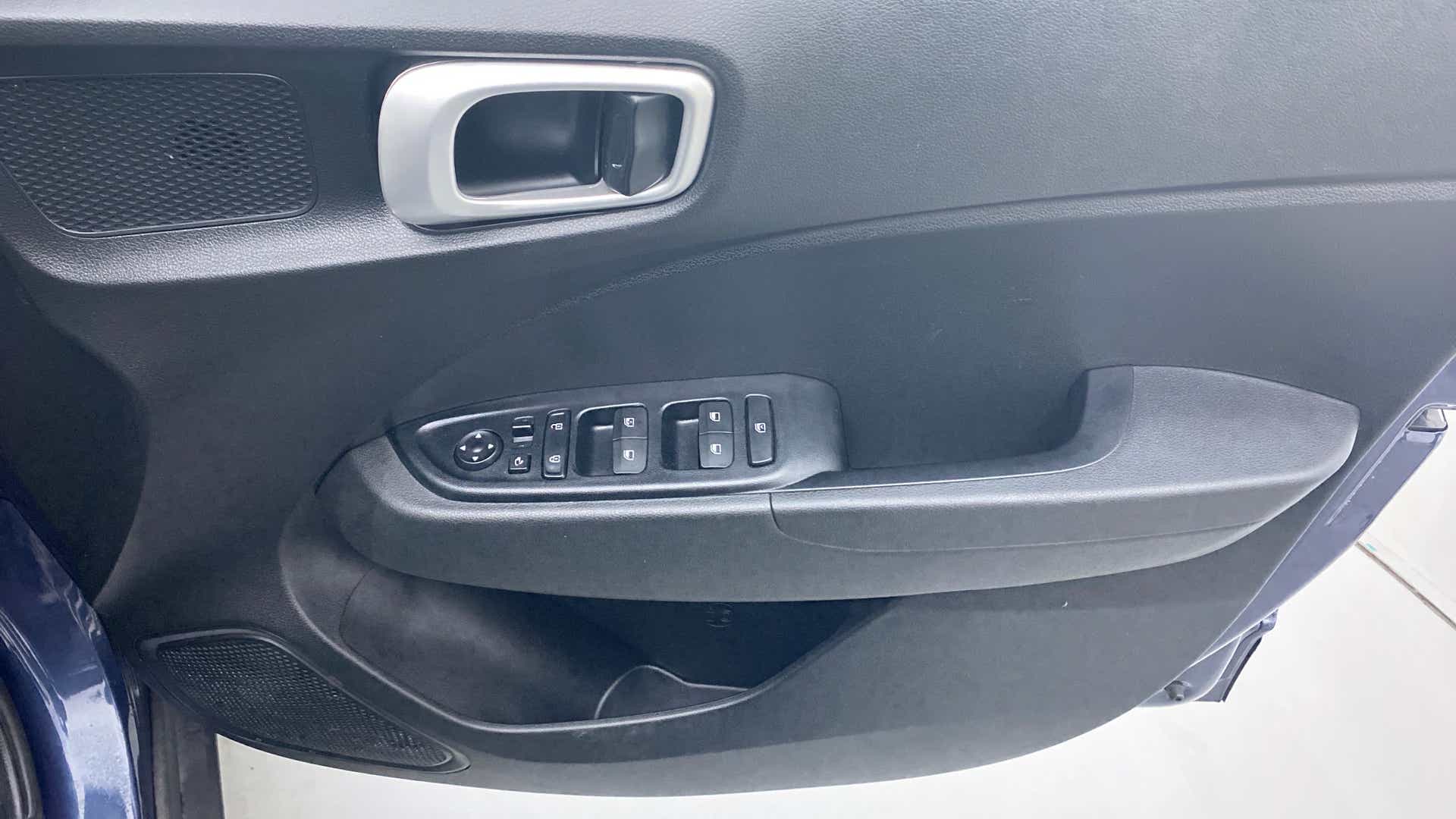 Interior driver door panel of a Hyundai Venue