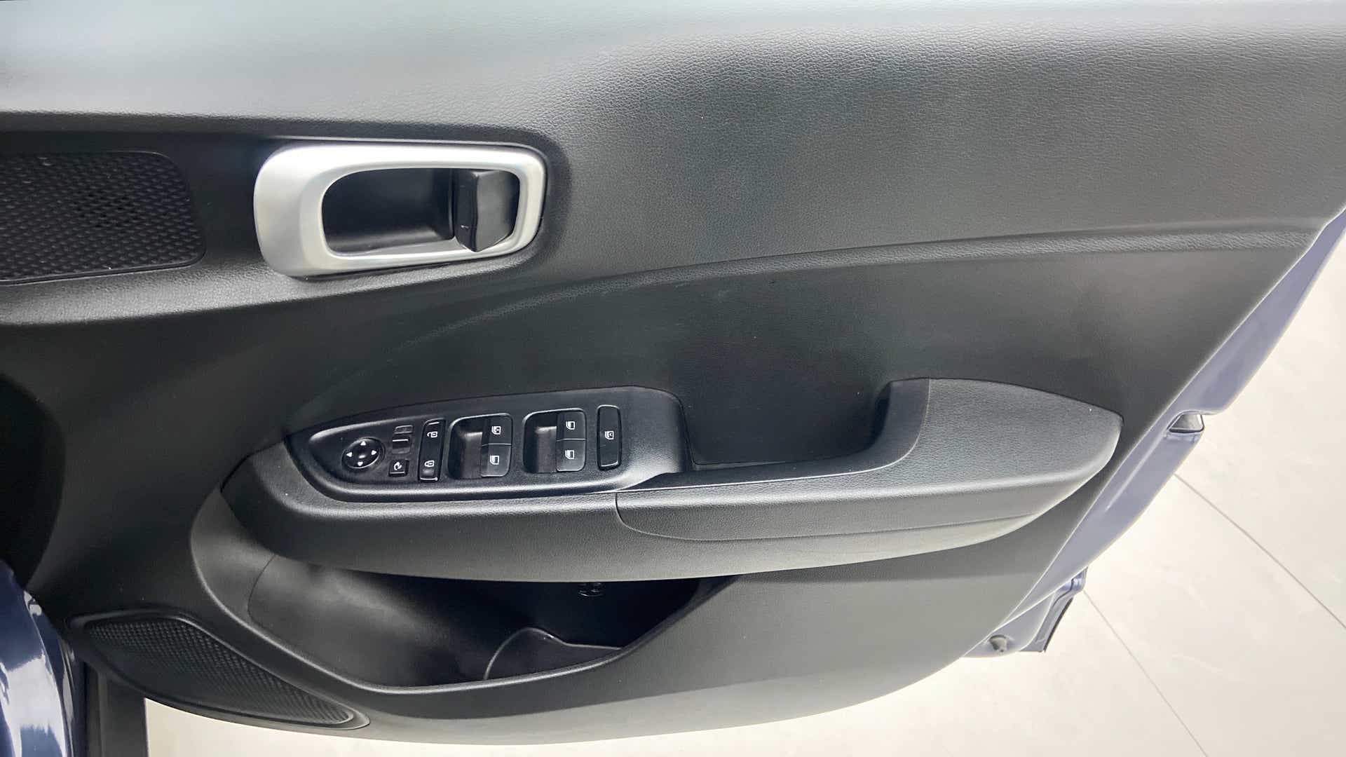 Interior driver-side door controls of a Hyundai Venue