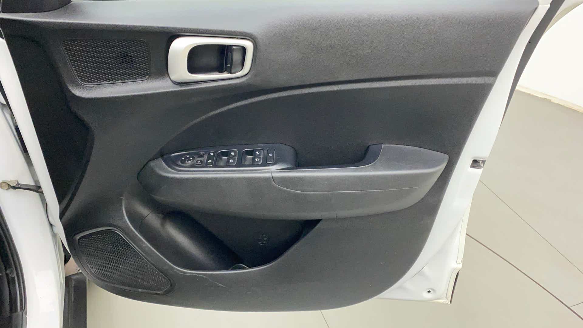 Interior driver door panel of a Hyundai Venue