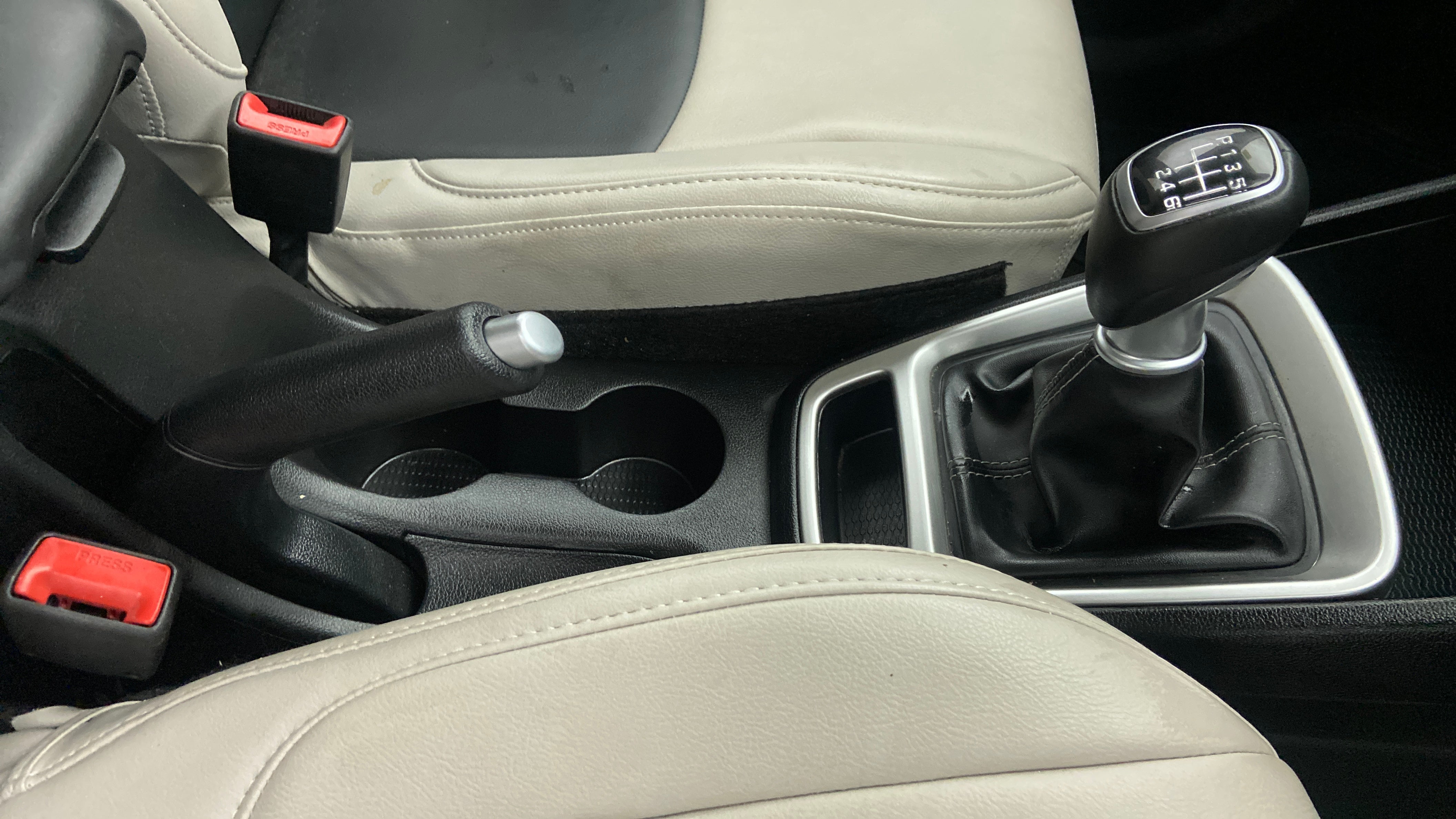 Gear shifter and handbrake area of a Hyundai Venue