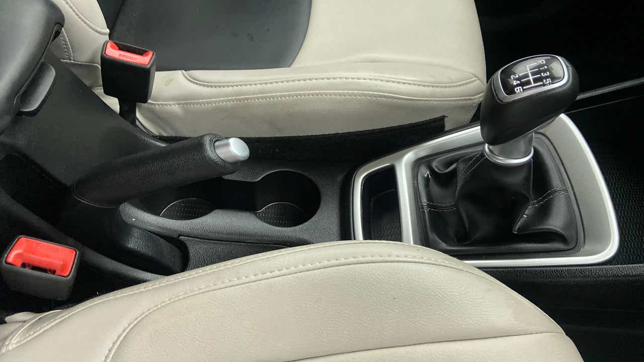 Gear shifter and handbrake area of a Hyundai Venue