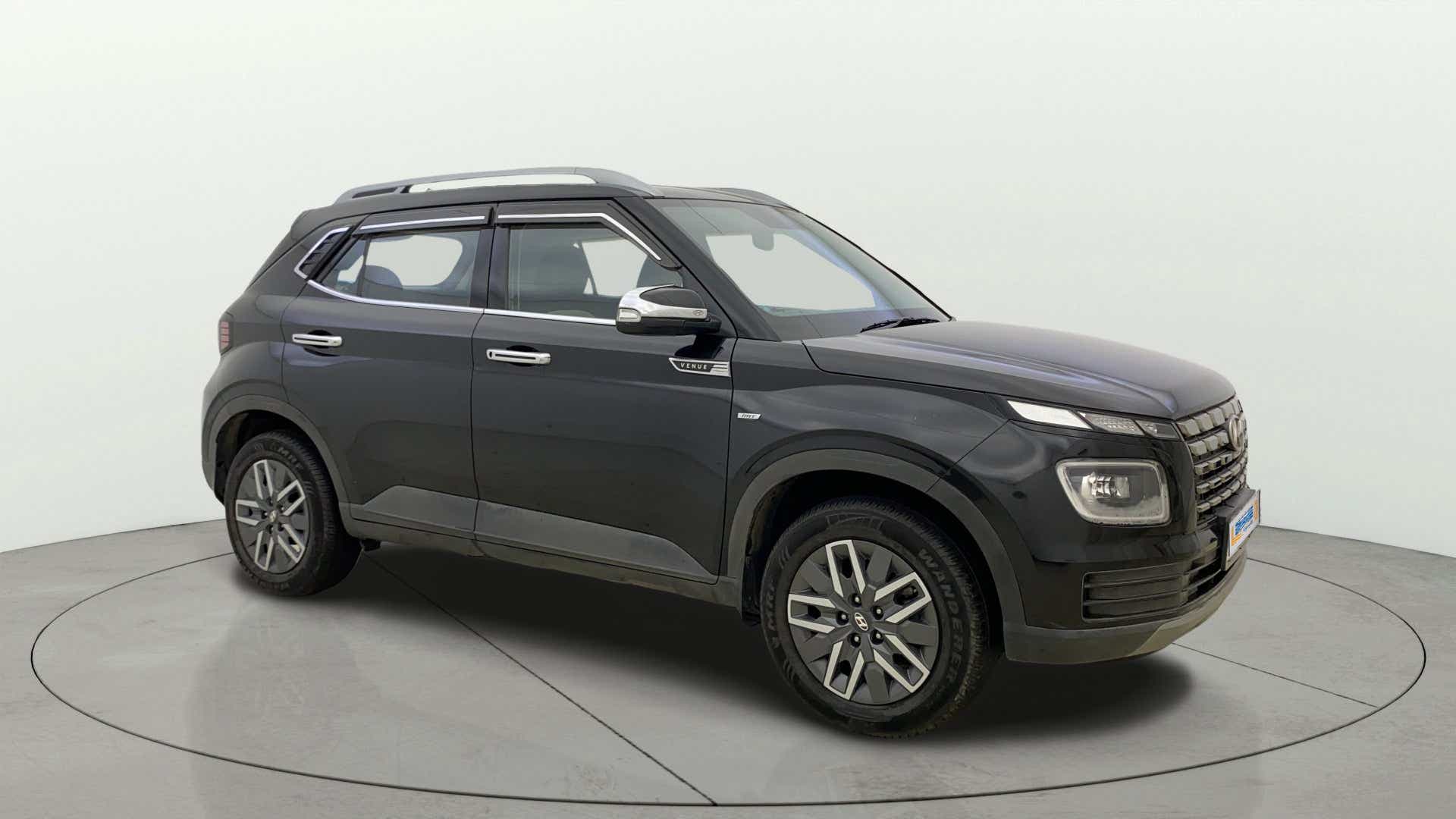 Front-side view of a Abyss Black Hyundai Venue