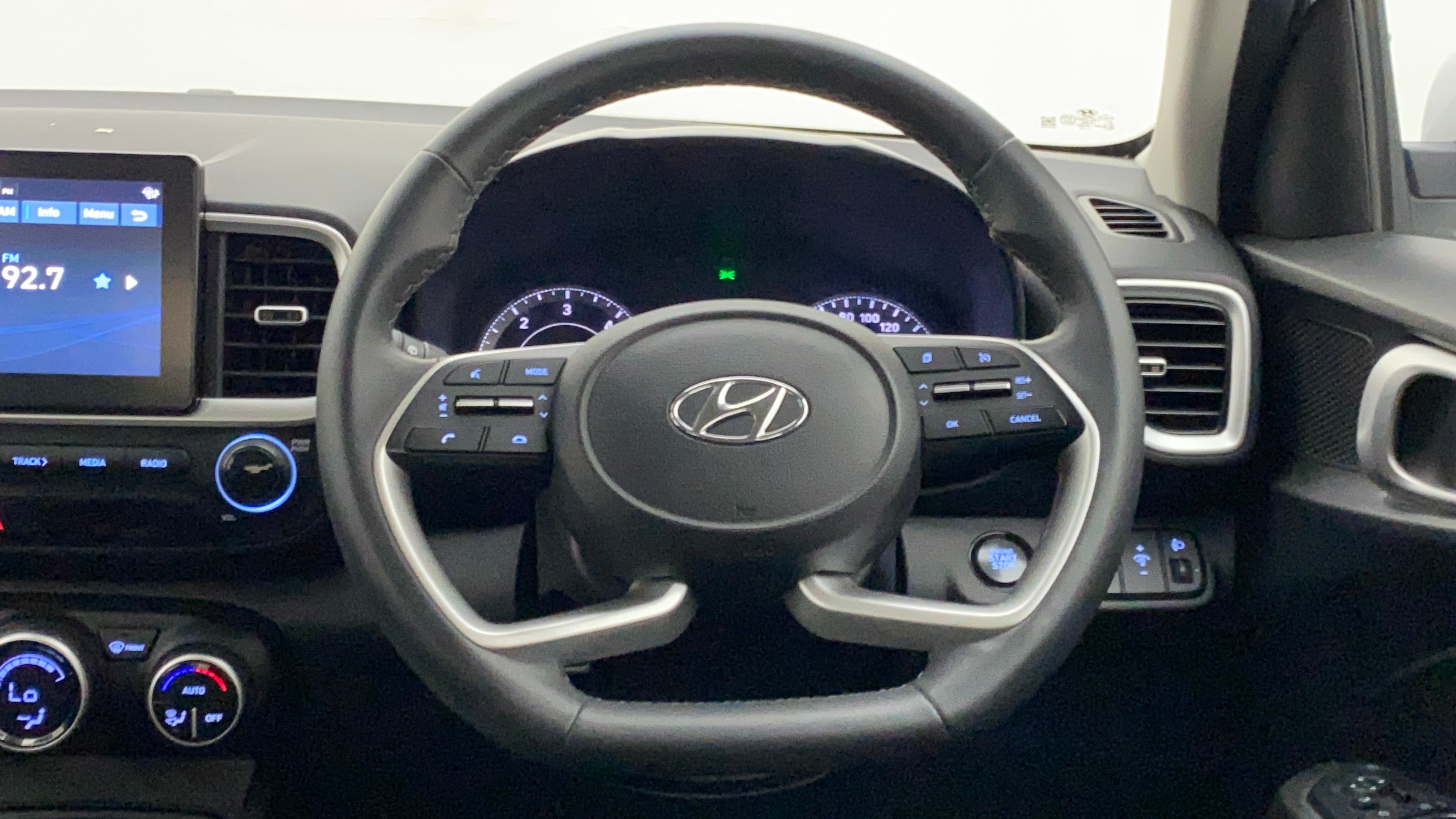 Dashboard and steering wheel view of a Hyundai Venue