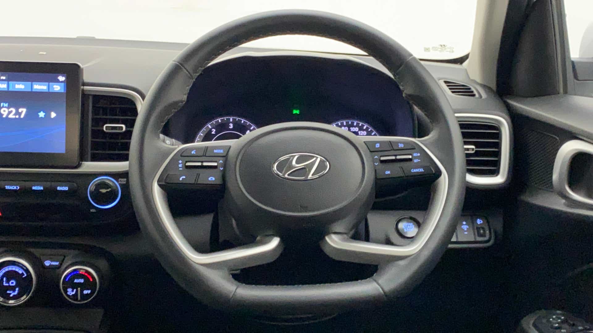 Dashboard and steering wheel view of a Hyundai Venue