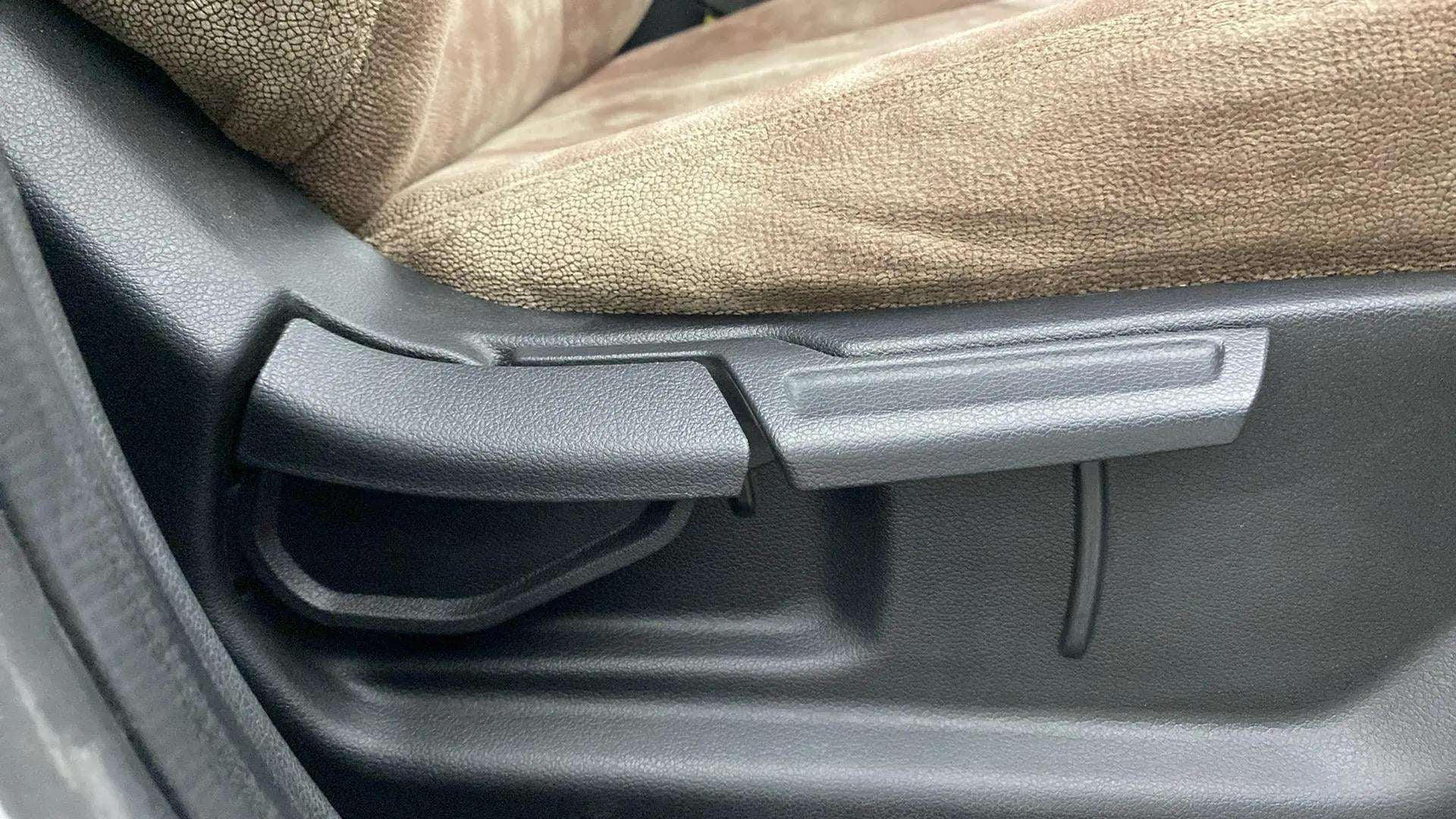 Close-up of driver's seat adjustment lever of a Hyundai Venue