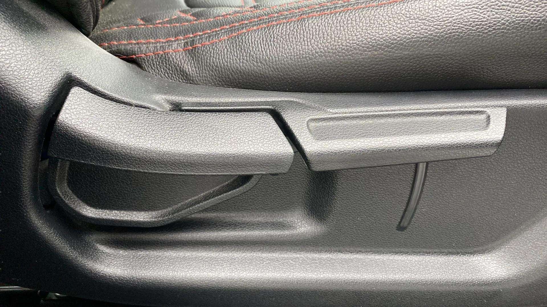Close-up of a seat adjustment lever in a Hyundai Venue