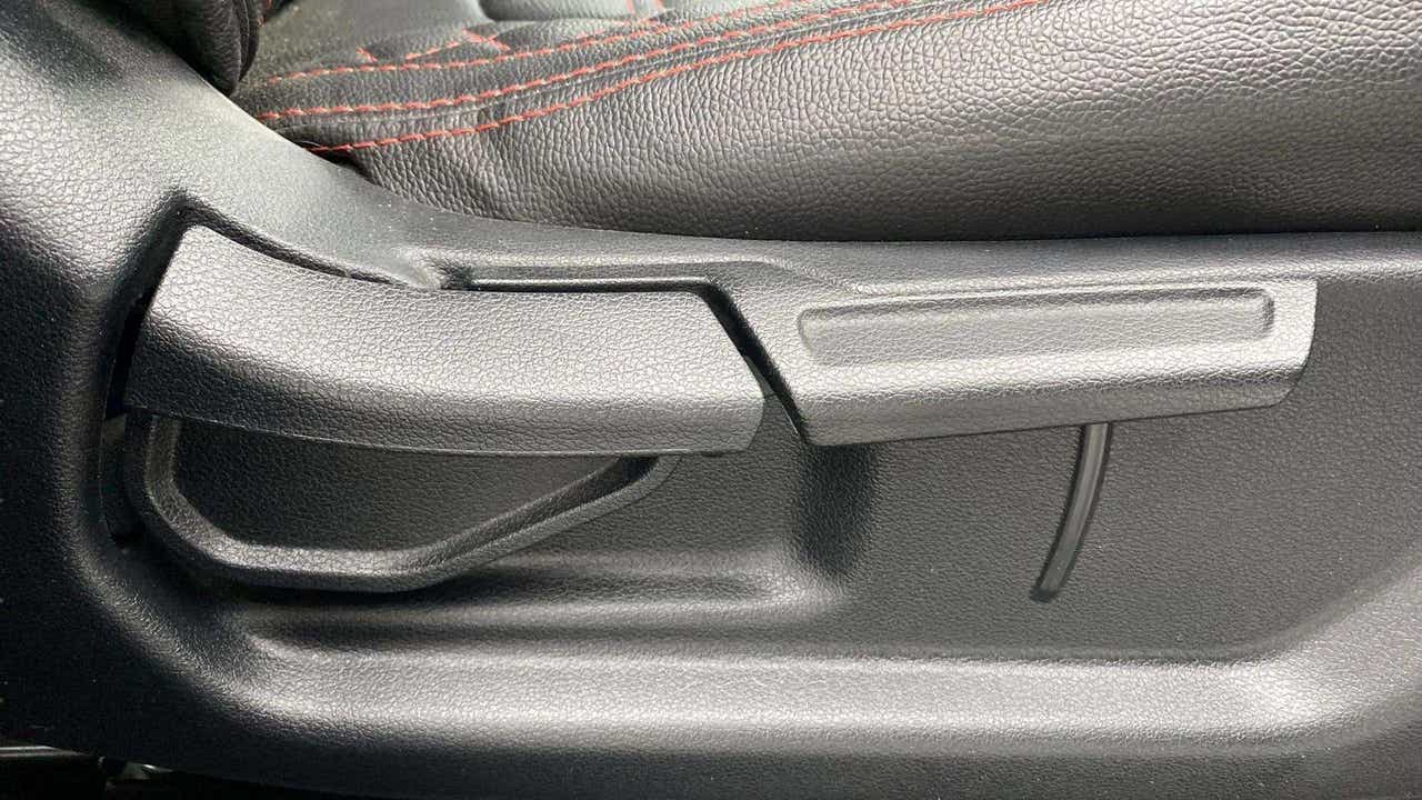 Close-up of a seat adjustment lever in a Hyundai Venue