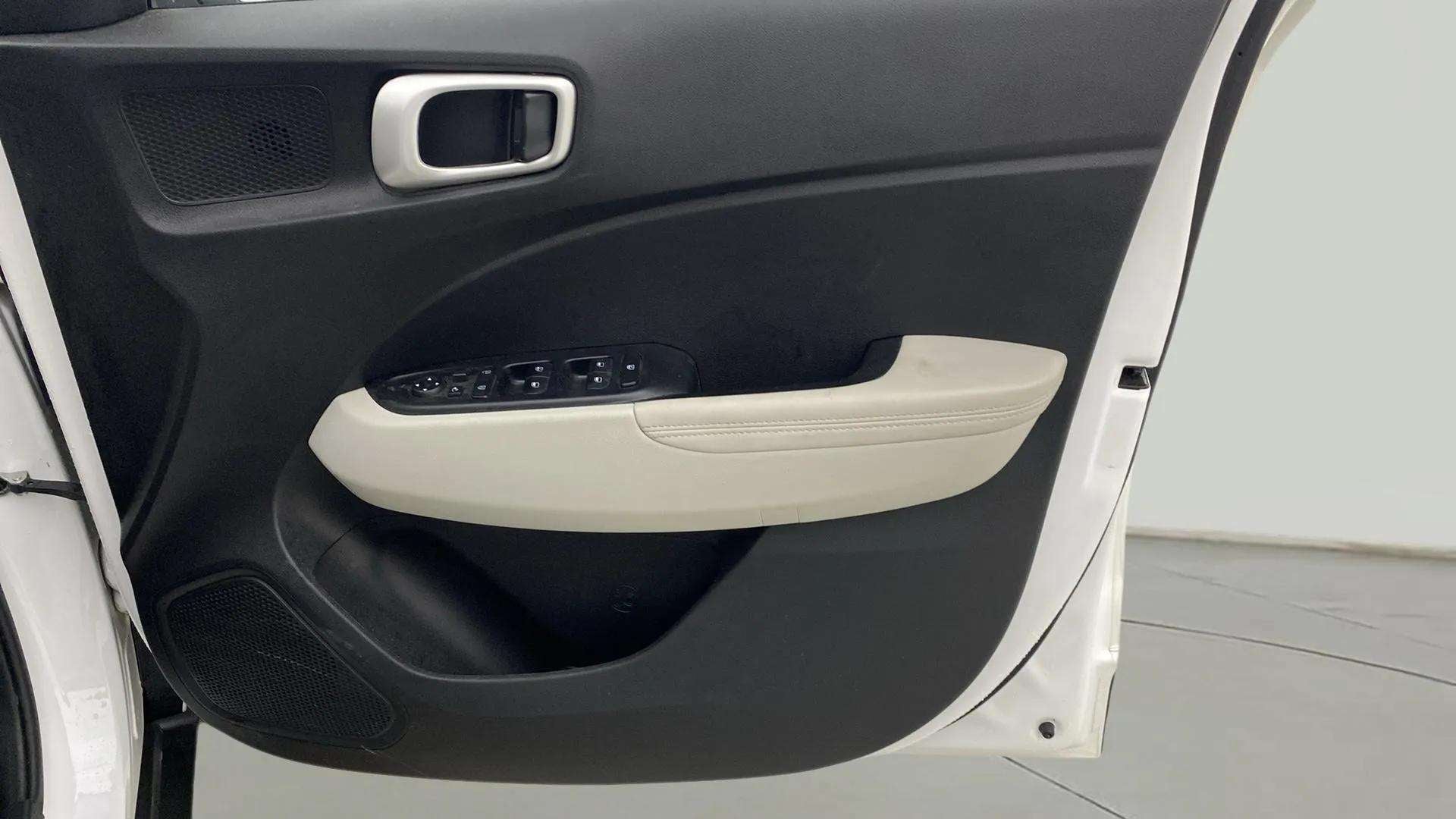 Interior driver side door panel of a Hyundai Venue