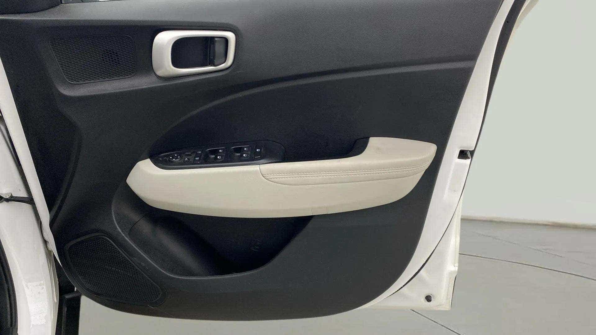 Interior driver side door panel of a Hyundai Venue