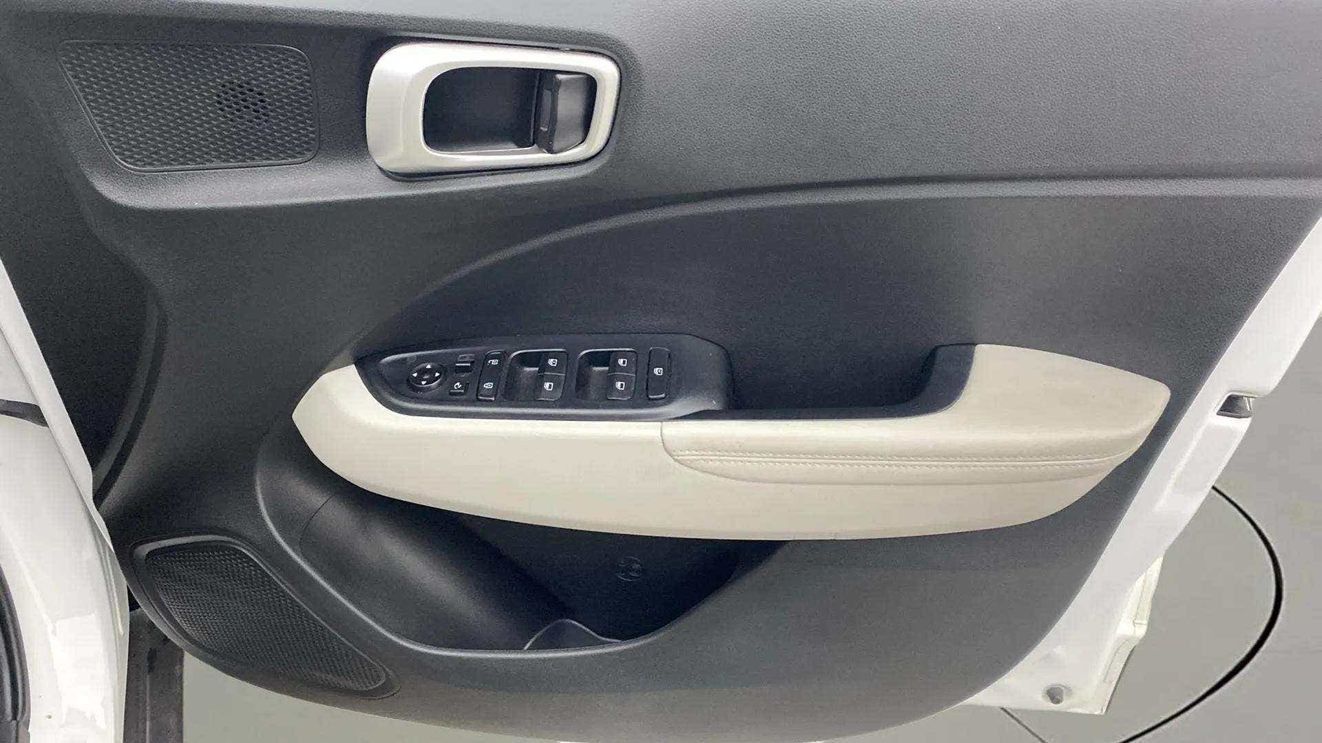 Interior door panel of a Hyundai Venue