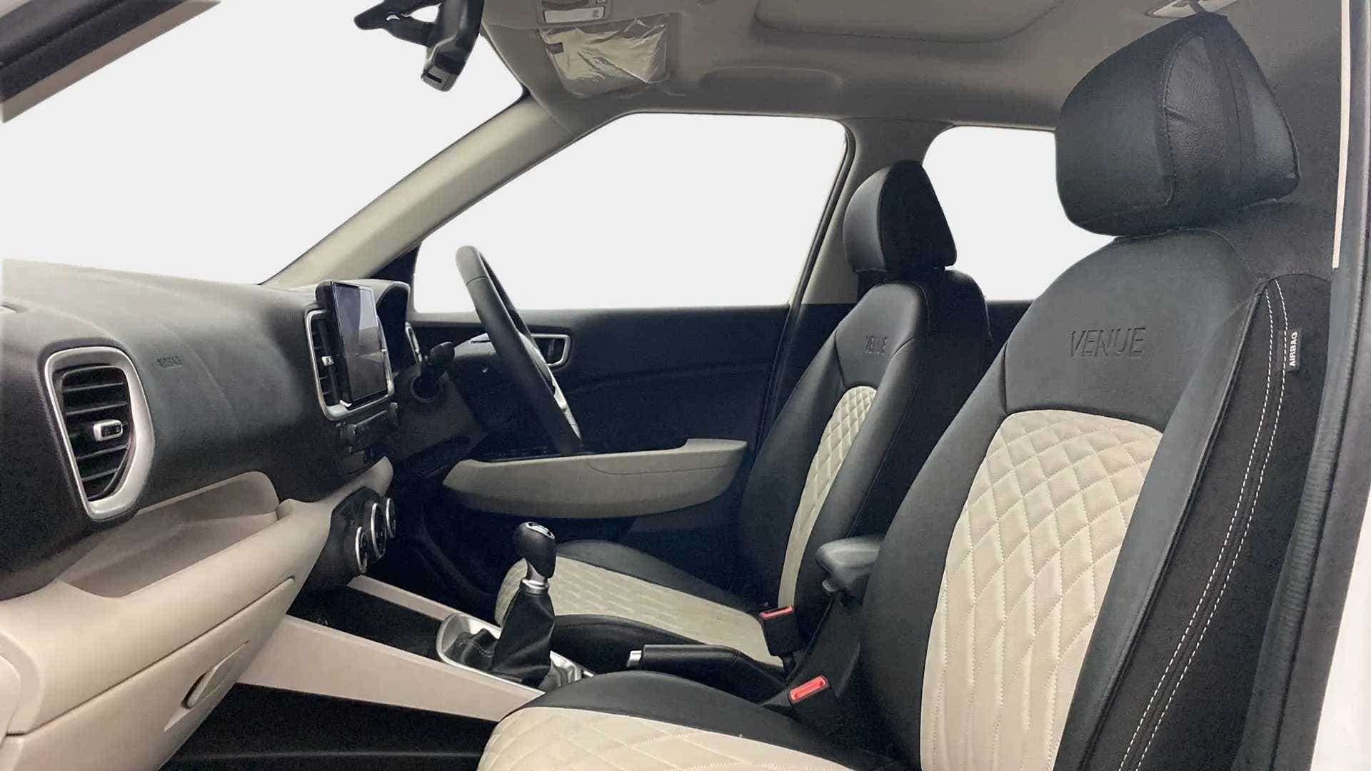 Interior dashboard and front seats of a Hyundai Venue