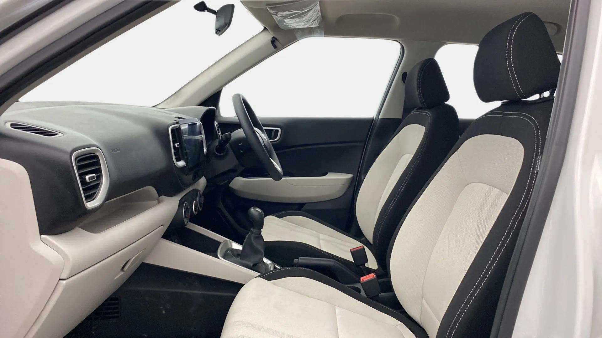 Interior dashboard and front seats of a Hyundai Venue