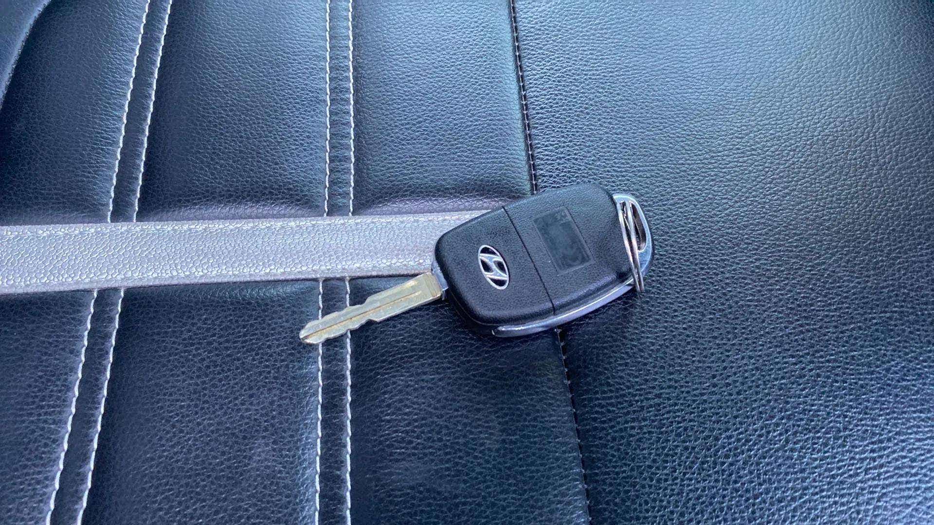 Car key on seat upholstery of a Hyundai Venue