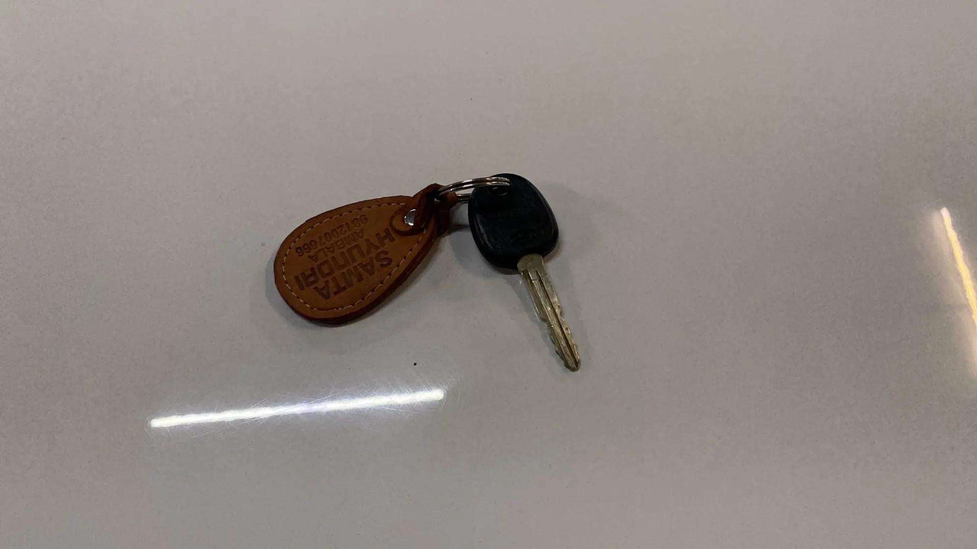 Key with keychain on a flat surface for a Hyundai Venue