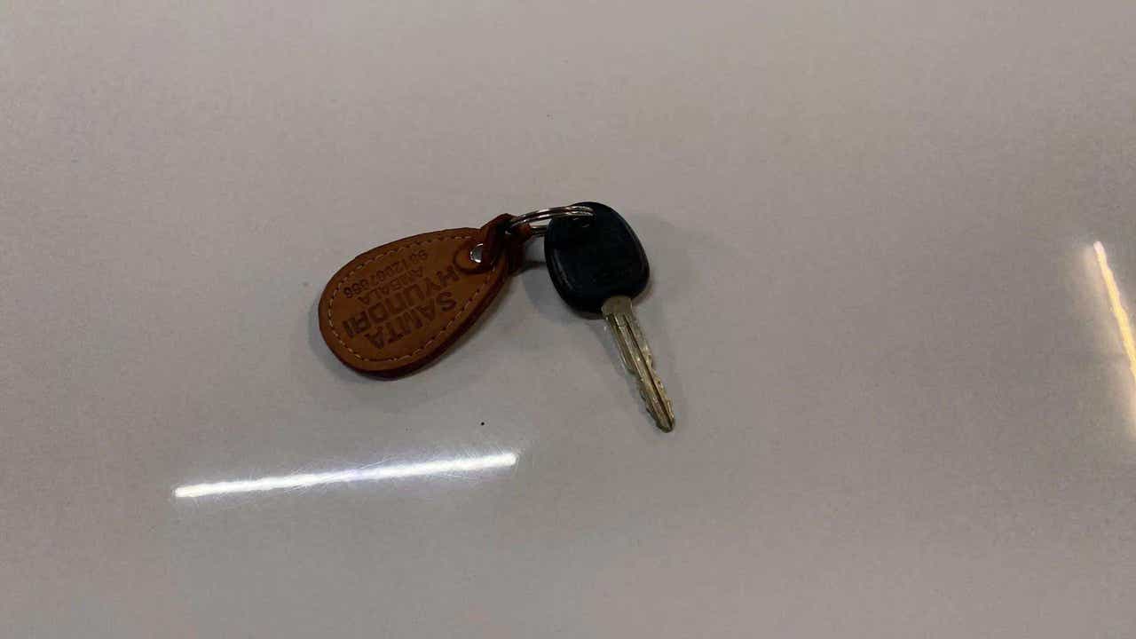 Key with keychain on a flat surface for a Hyundai Venue